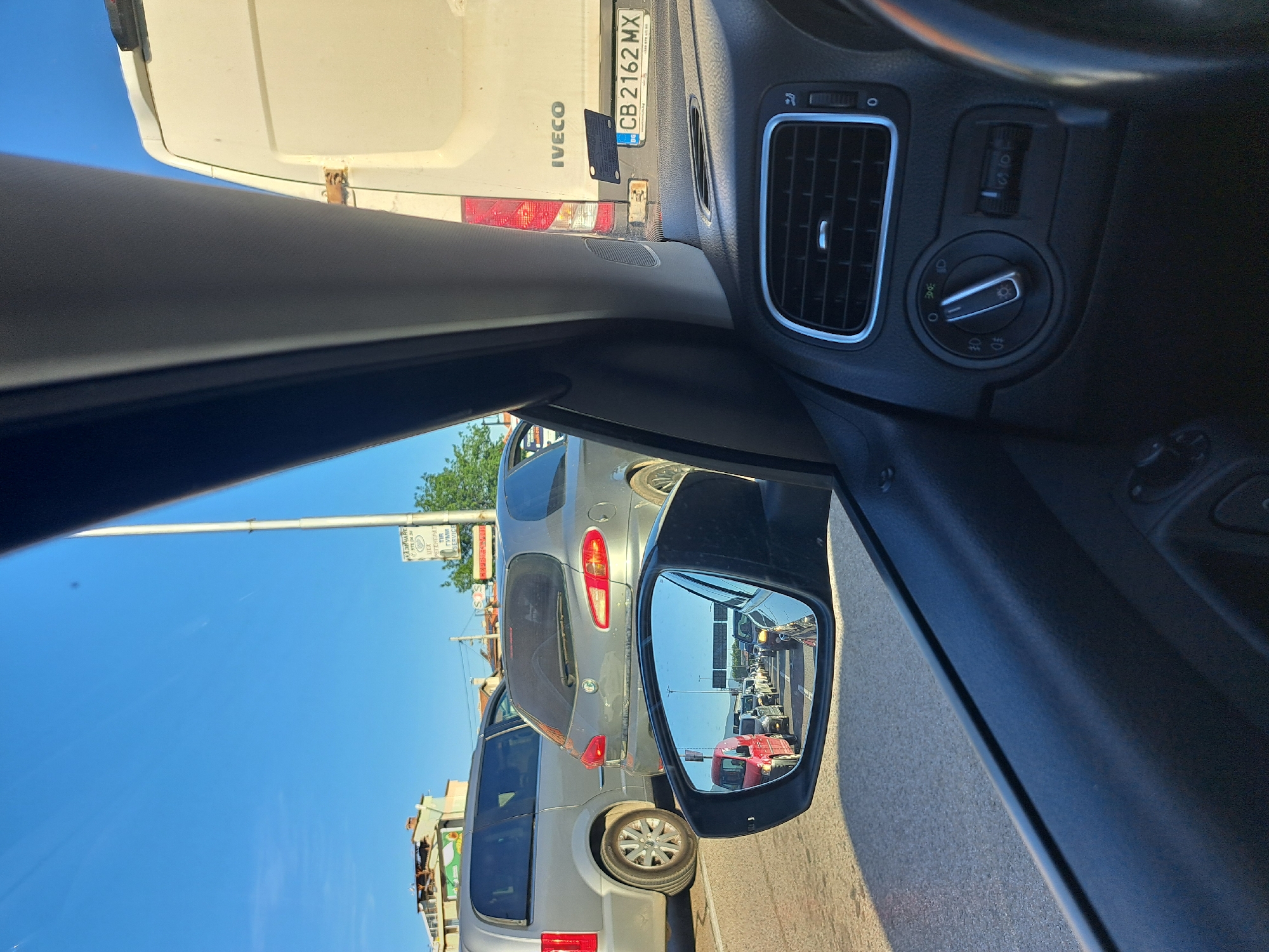 Car ride through traffic jam captured from multiple interior angles