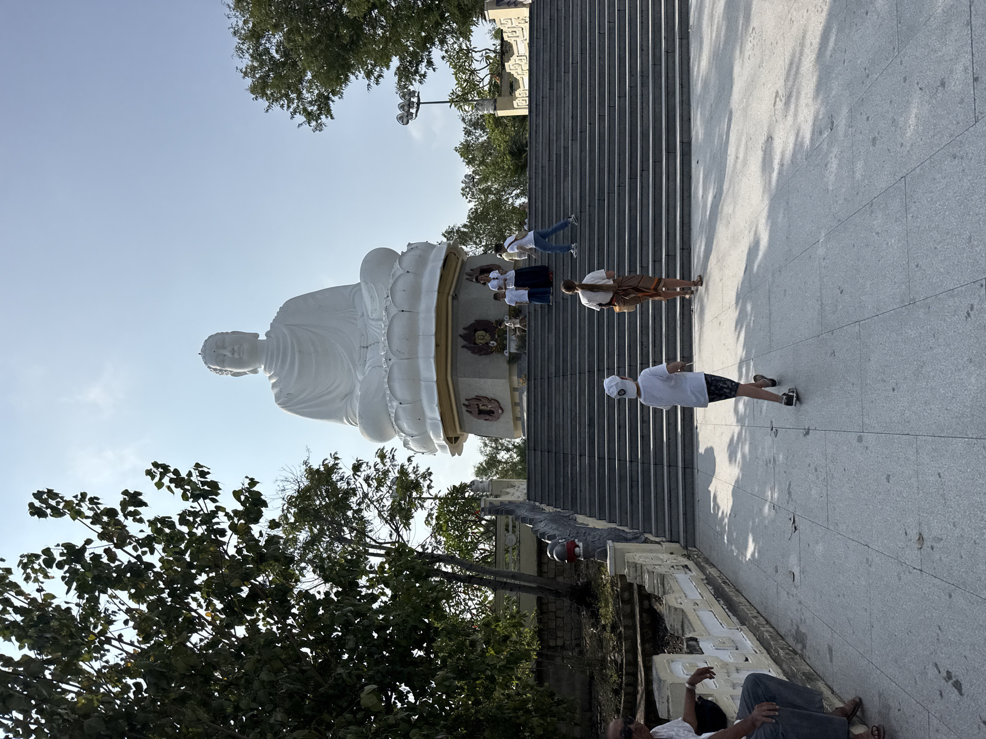 White Buddha statue captured at temple complex in Vietnam