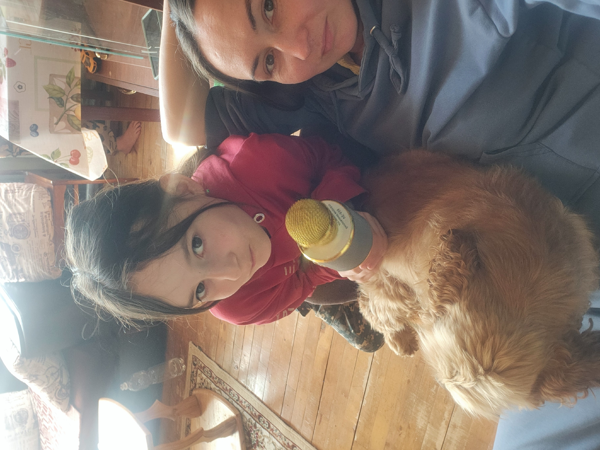 Family enjoys morning karaoke session with dog in Arkhangelskoye home