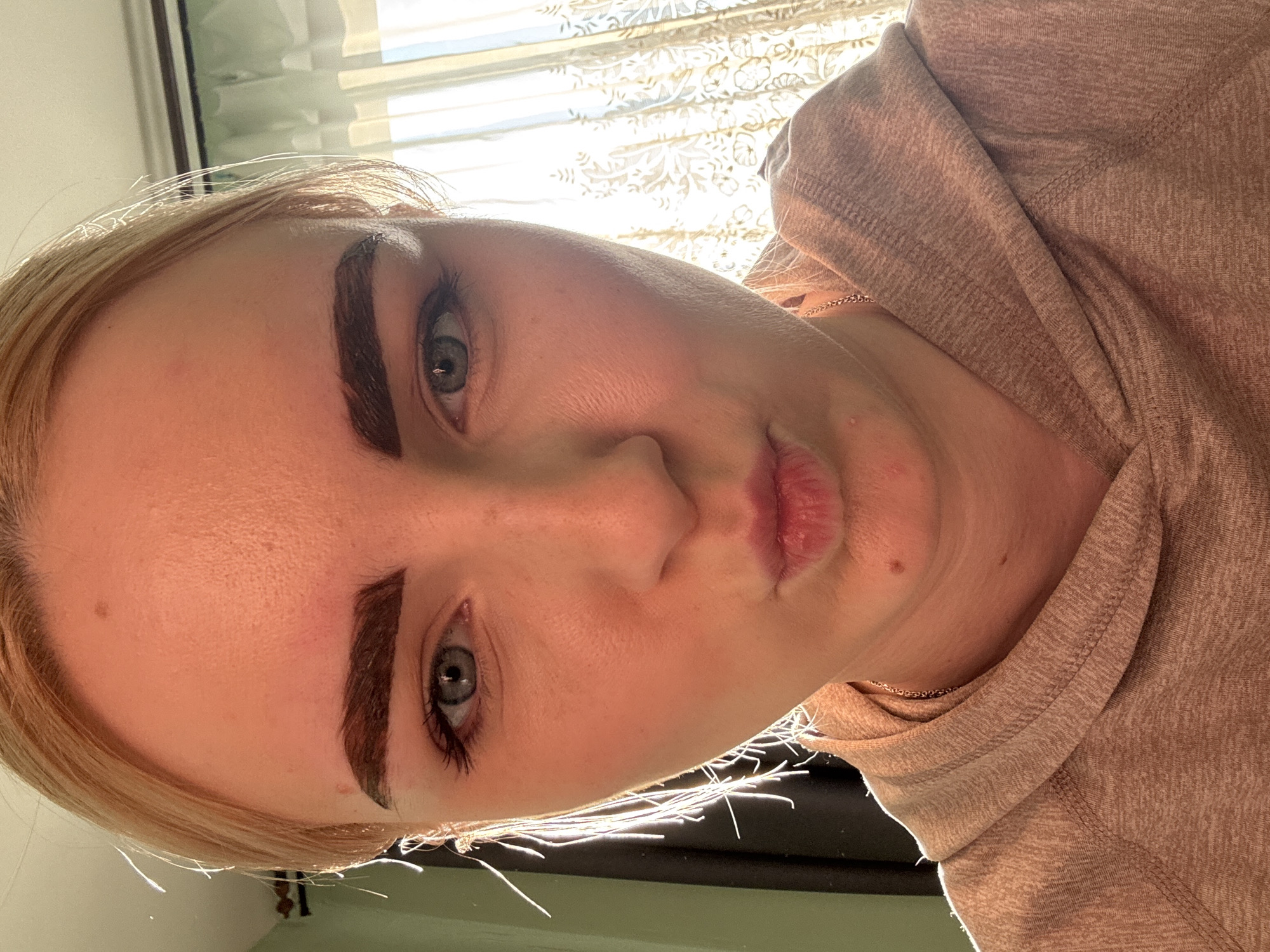 Woman takes selfies with varying expressions in Russia
