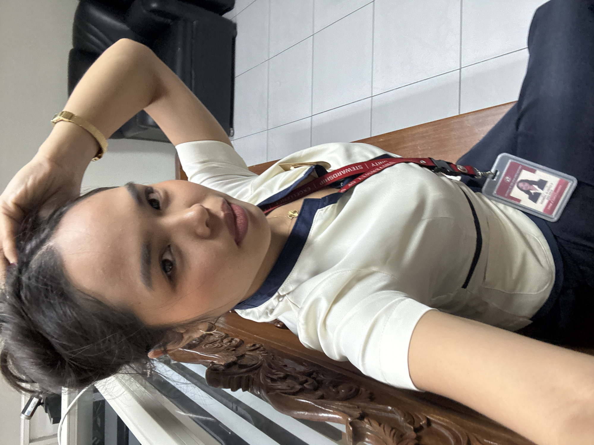 USP students in uniform killing time in a Davao waiting area