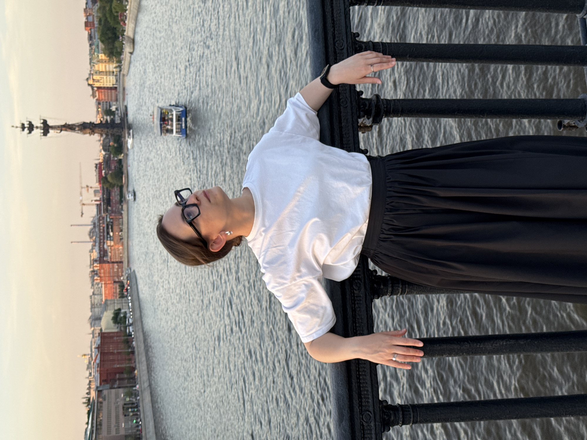 Woman enjoys sunset views from Moscow's Krymsky Bridge