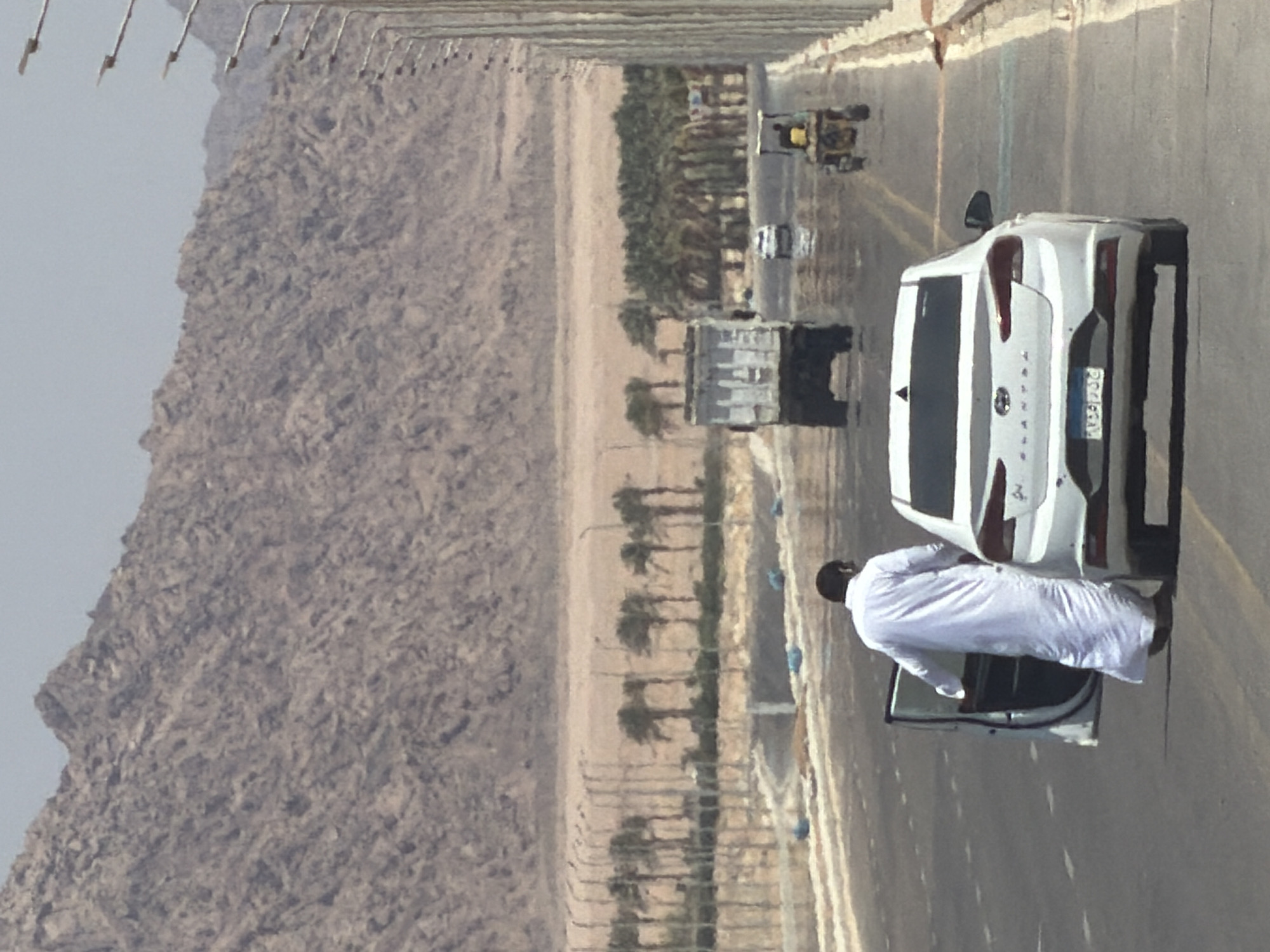 Roadside stop on an arid Egyptian highway, July morning