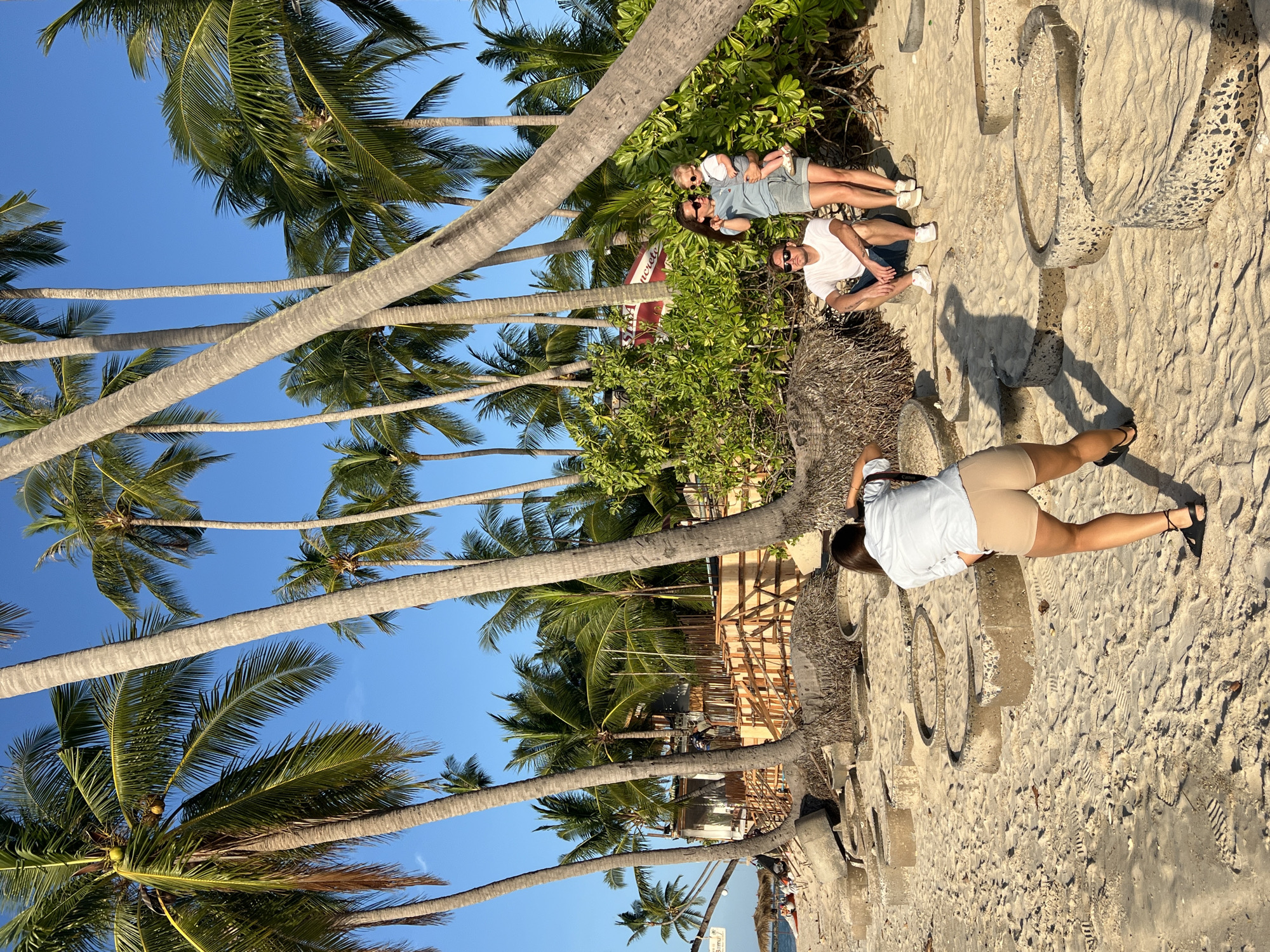 Family photoshoot amid beach construction at Thai resort