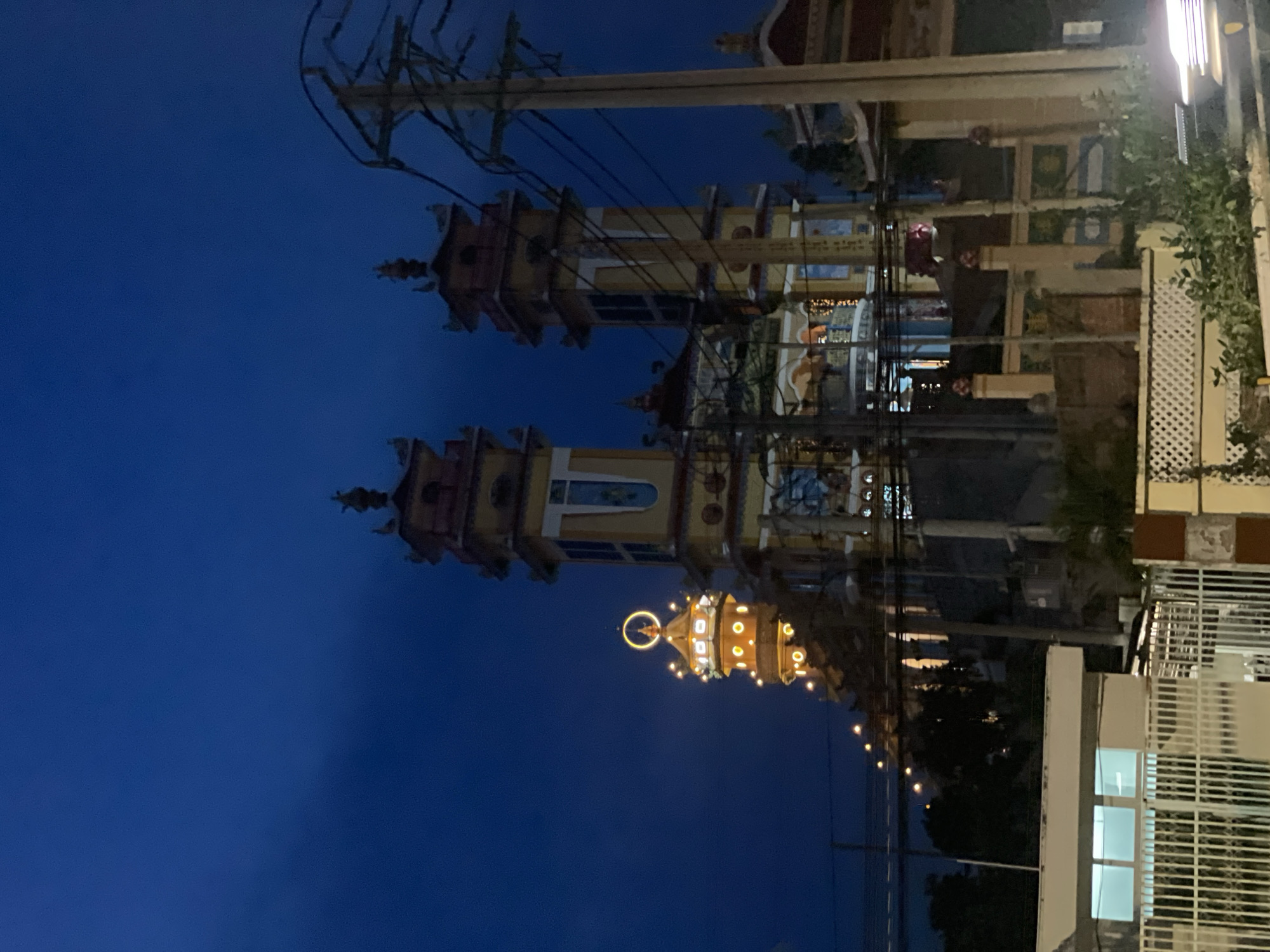 Illuminated temple towers at night in Phu Thuy Ward, Vietnam