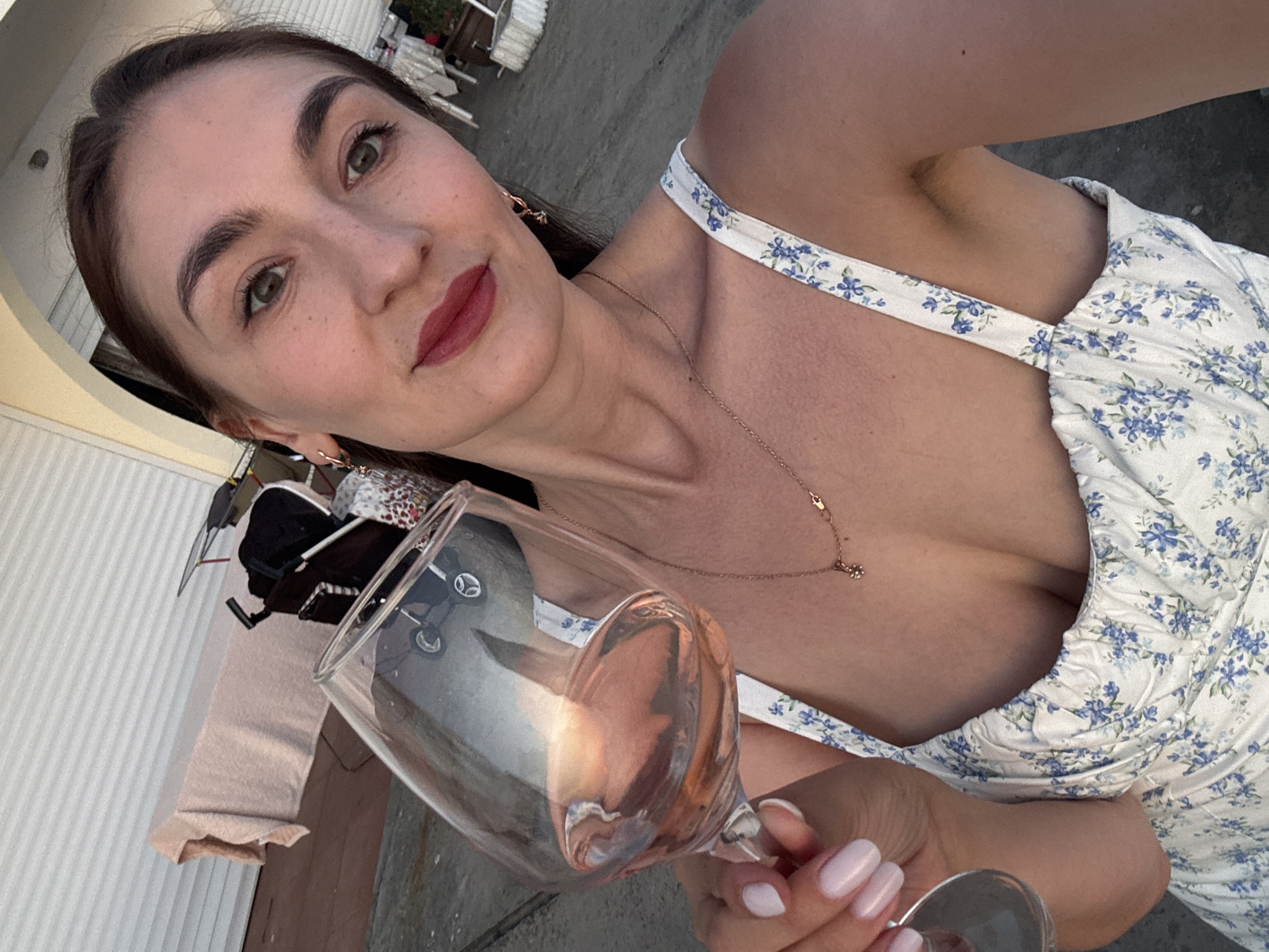 Woman documents sunset wine moment on Sochi beach