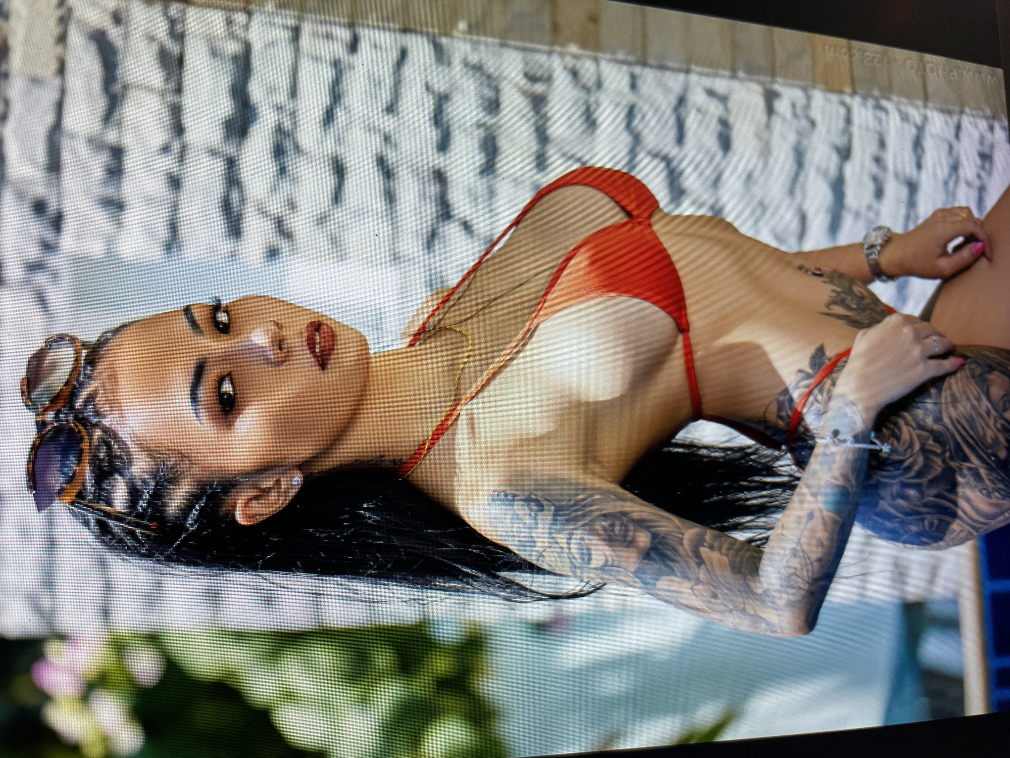 Woman relaxes poolside at Philippines resort spa