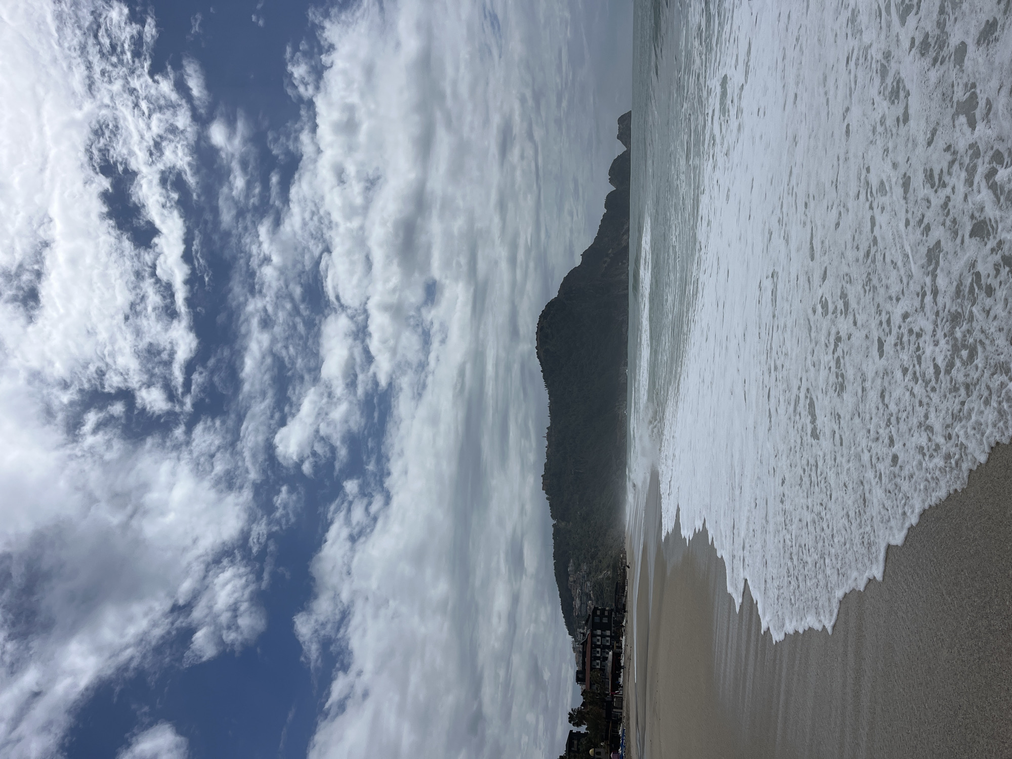 Beachgoers document morning waves and activity in Alanya, Turkey