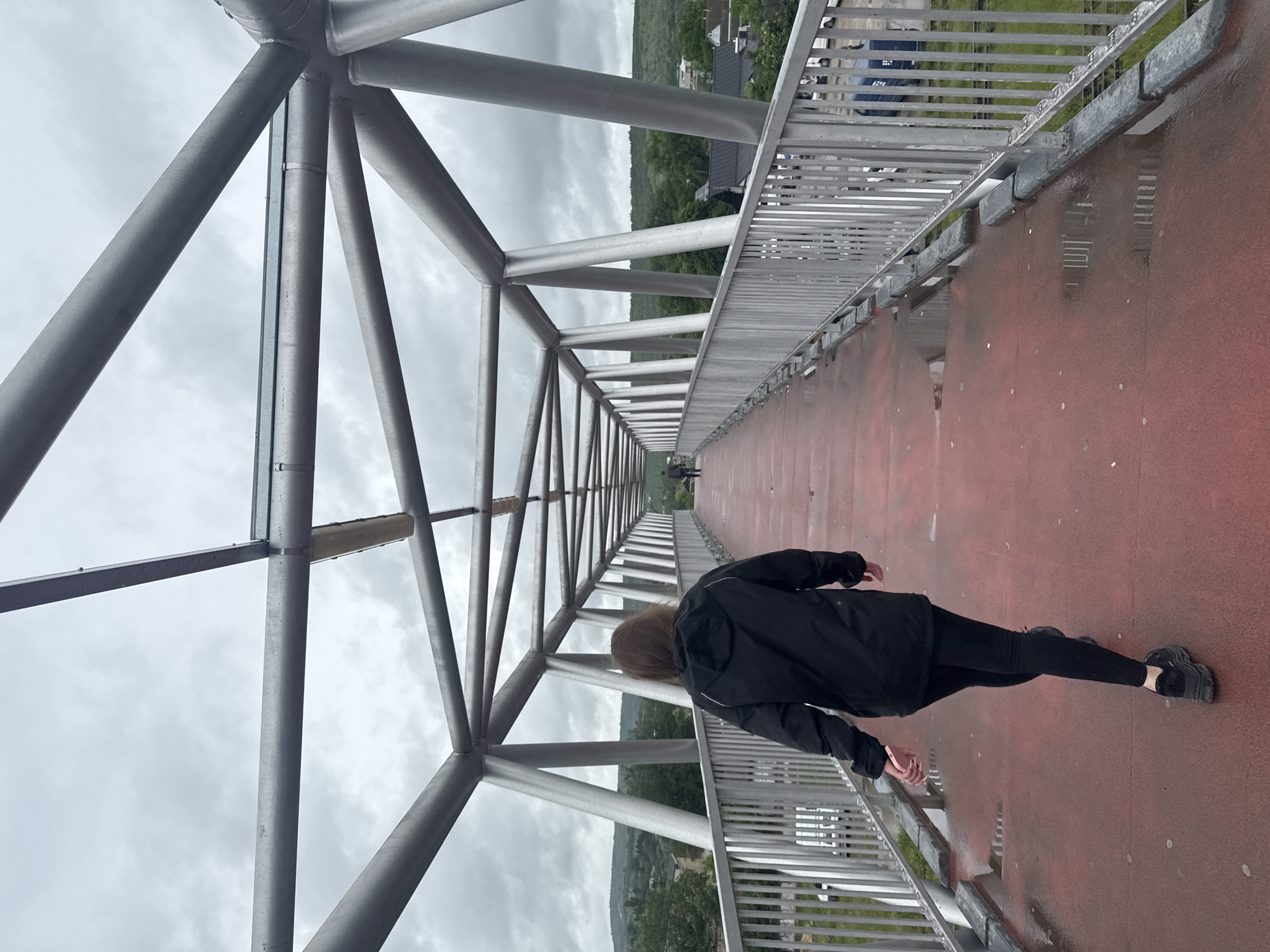 Morning walk documented across pedestrian bridge in Strășeni, Moldova