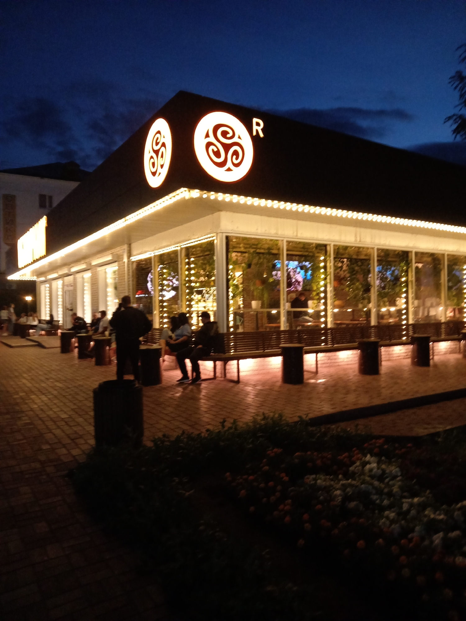 Rudny's fountain lights up a damp summer evening
