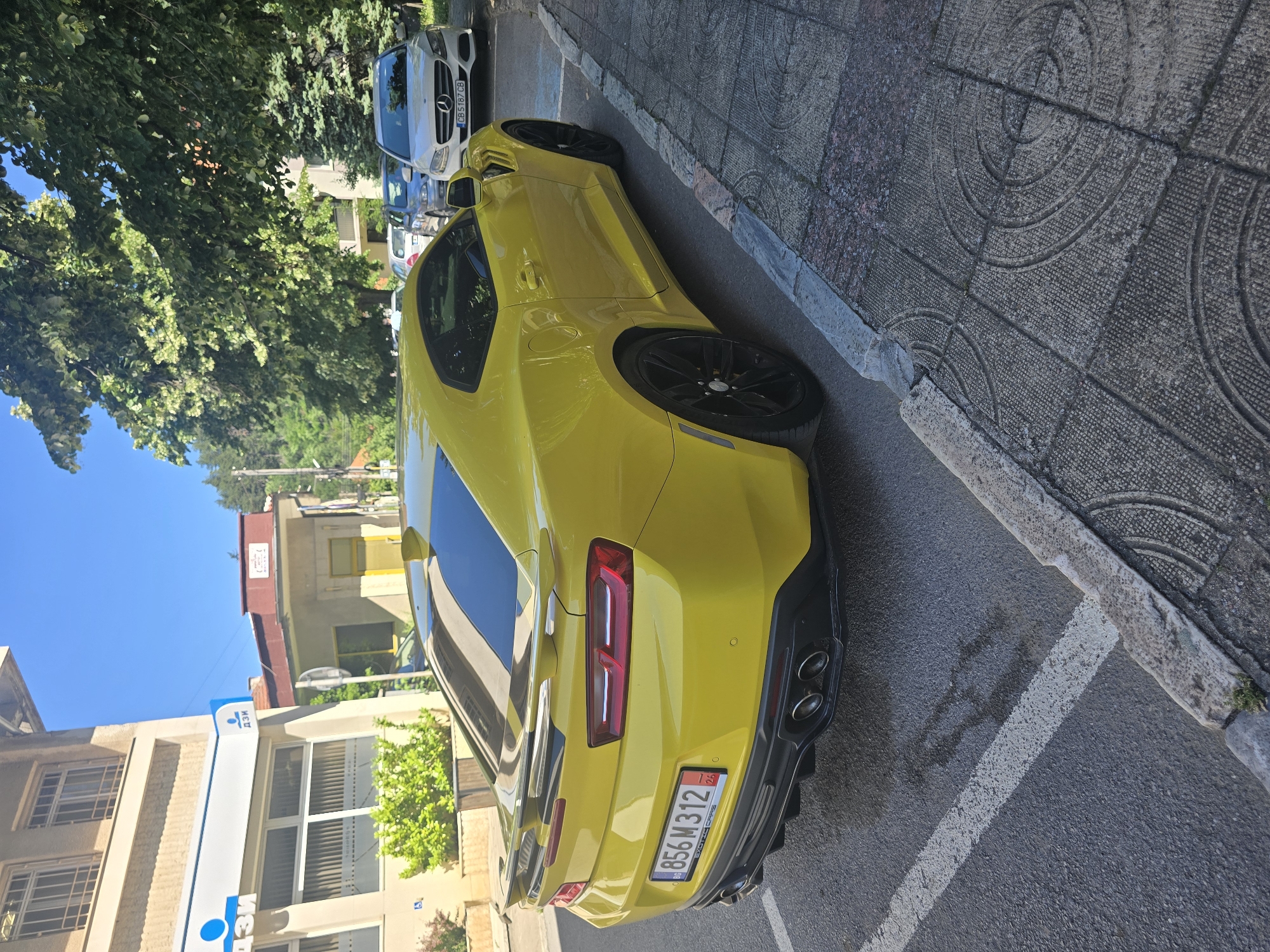 Yellow Camaro ZL1 parked on a Berkovitsa street