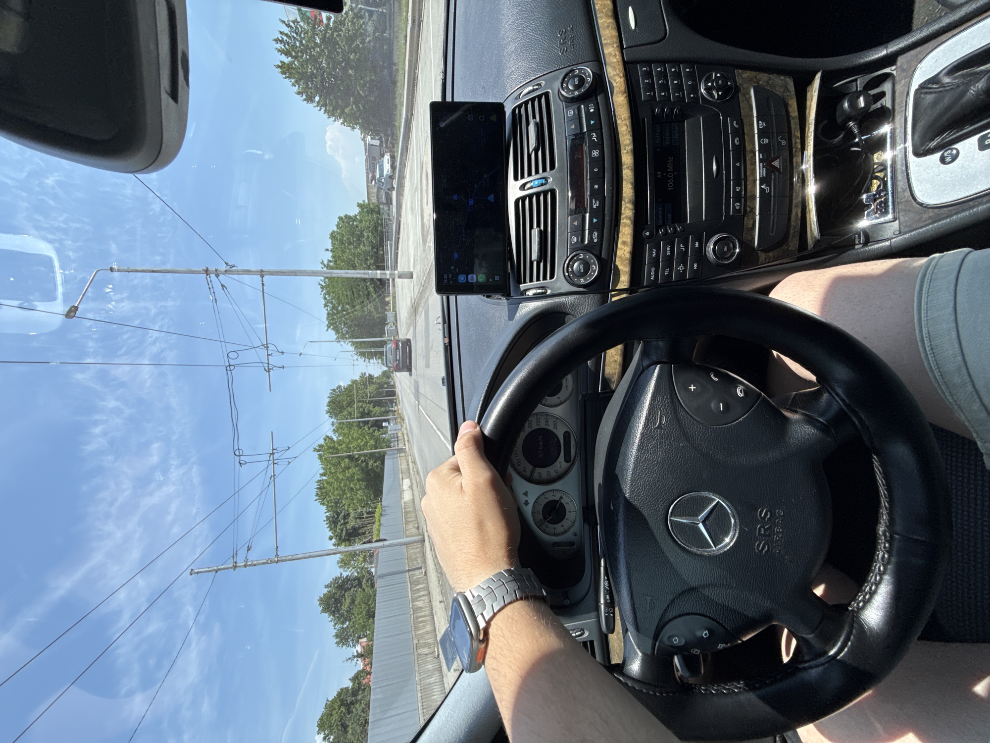Driver navigates Mercedes through sunny Stara Zagora streets