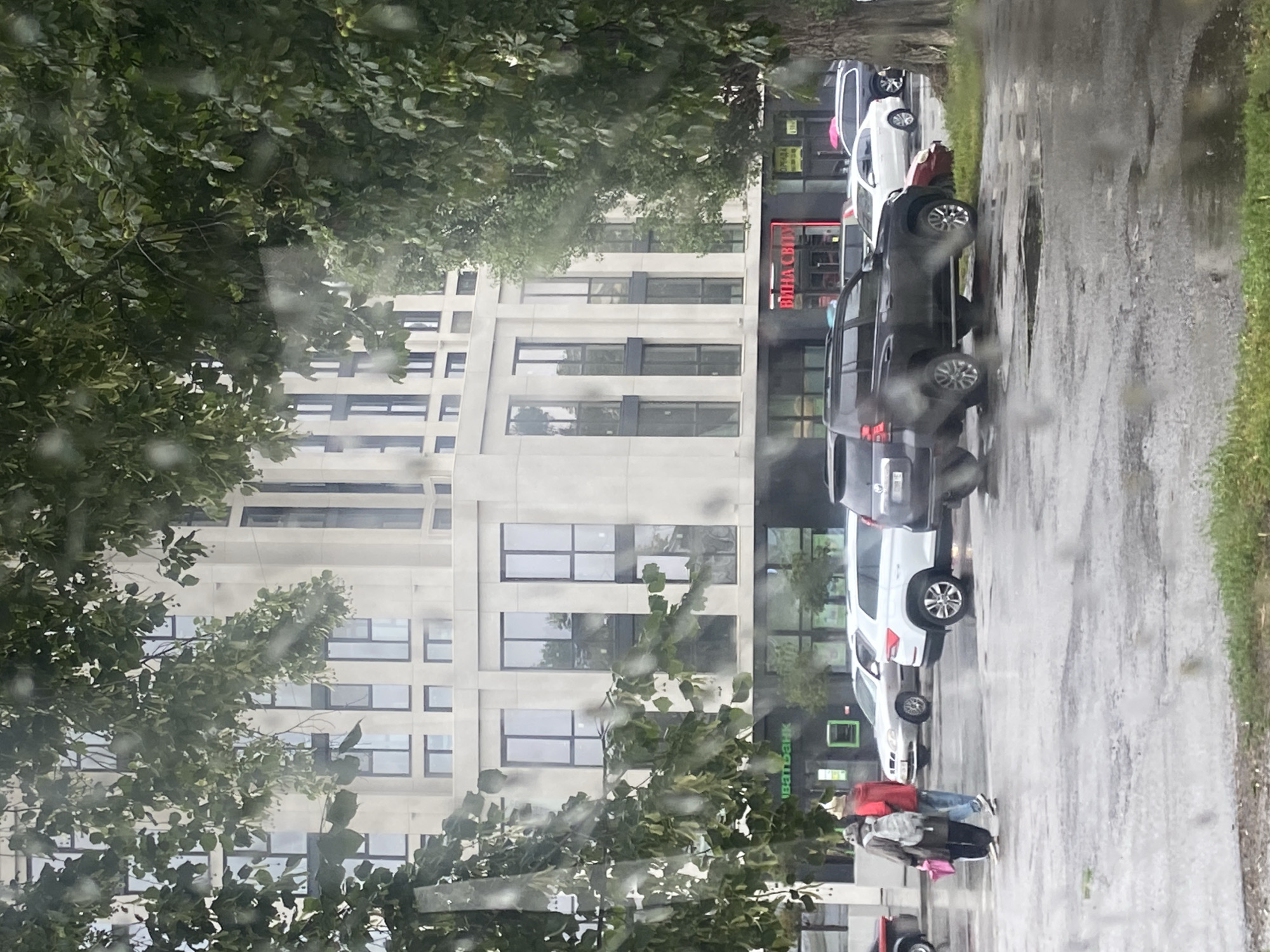 Rainy morning street and bus scenes in Nyzhni Mlyny, Ukraine