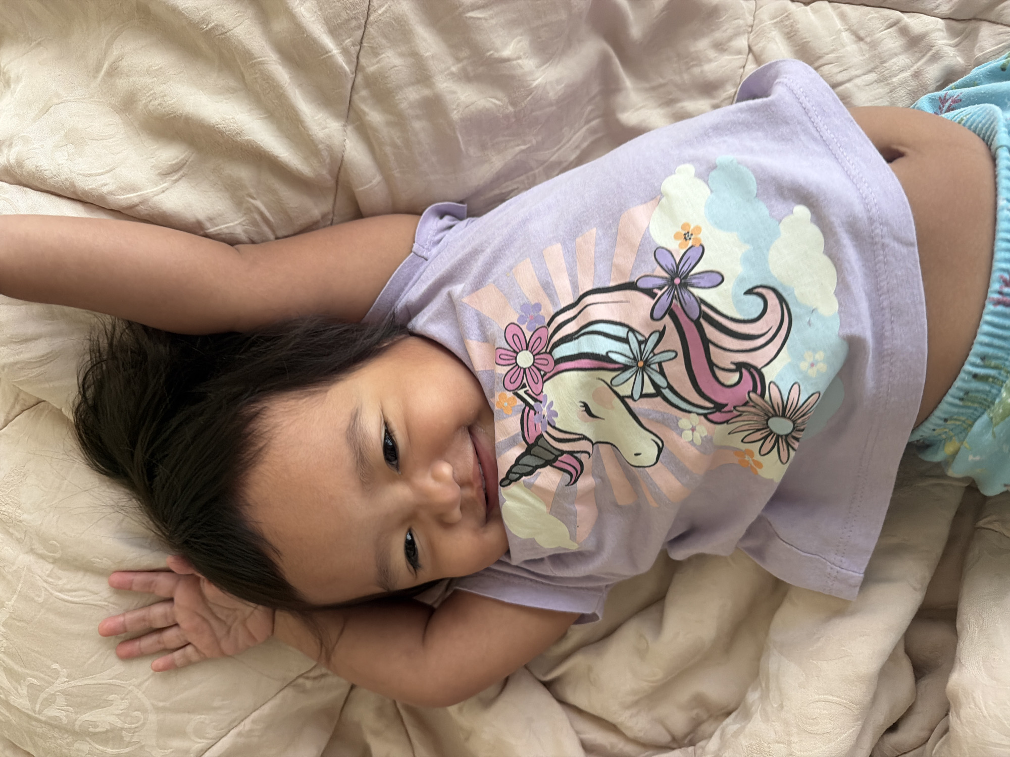 Cozy bedtime moments on a quilted blanket in Central Jakarta