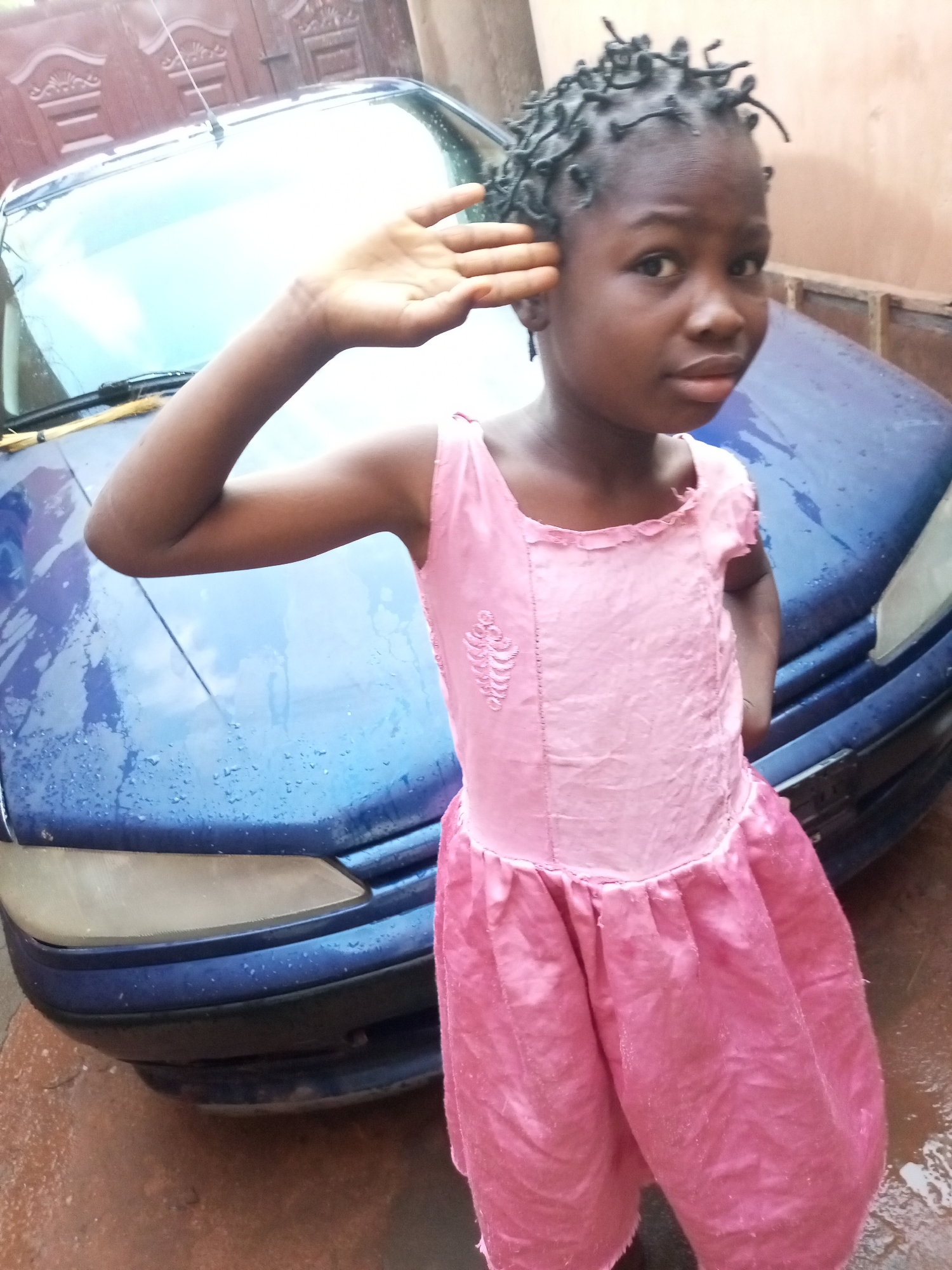 Children in everyday moments, modest outdoor settings
