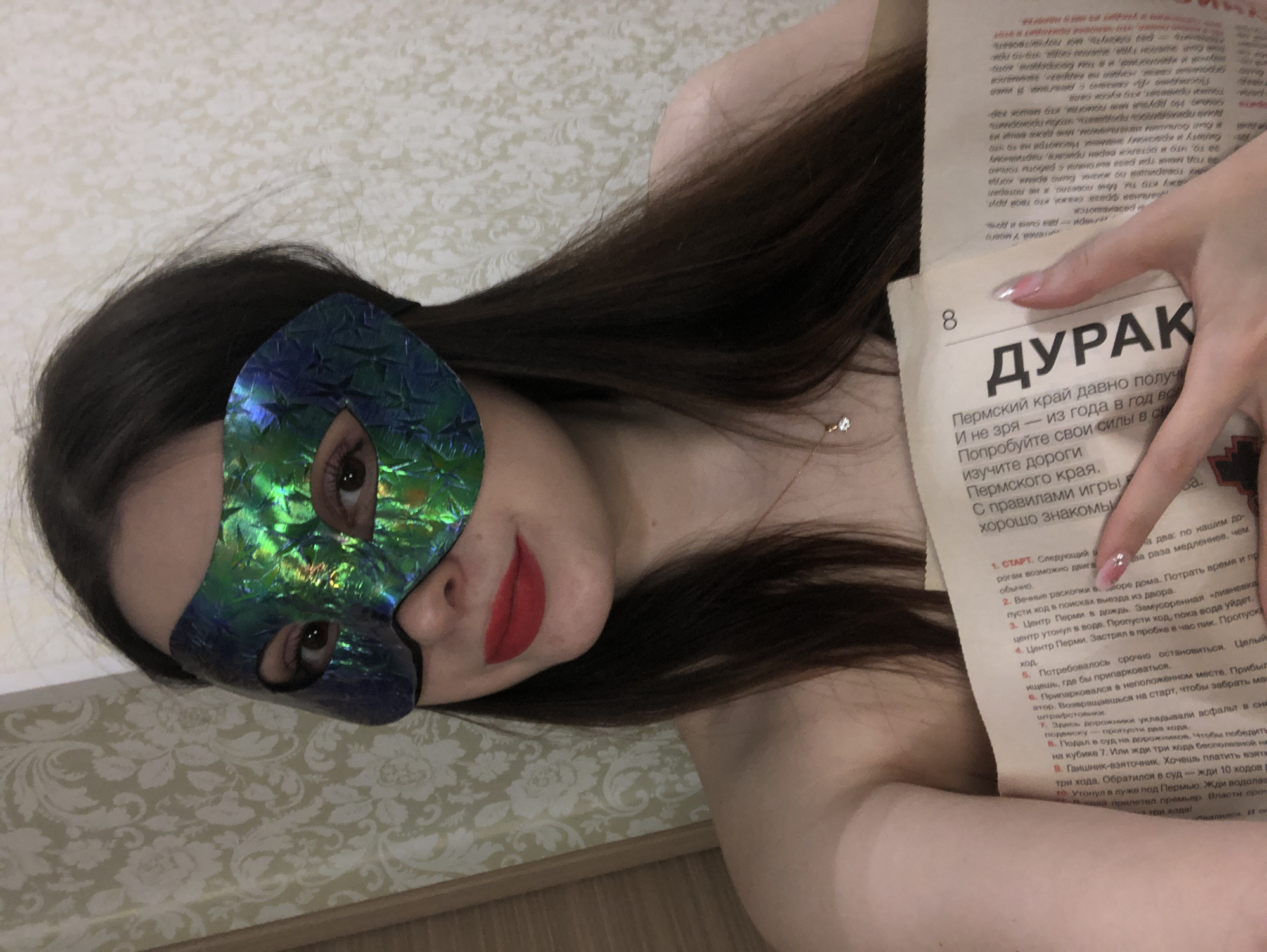 Person takes mirror selfies with accessories in Noviy bedroom