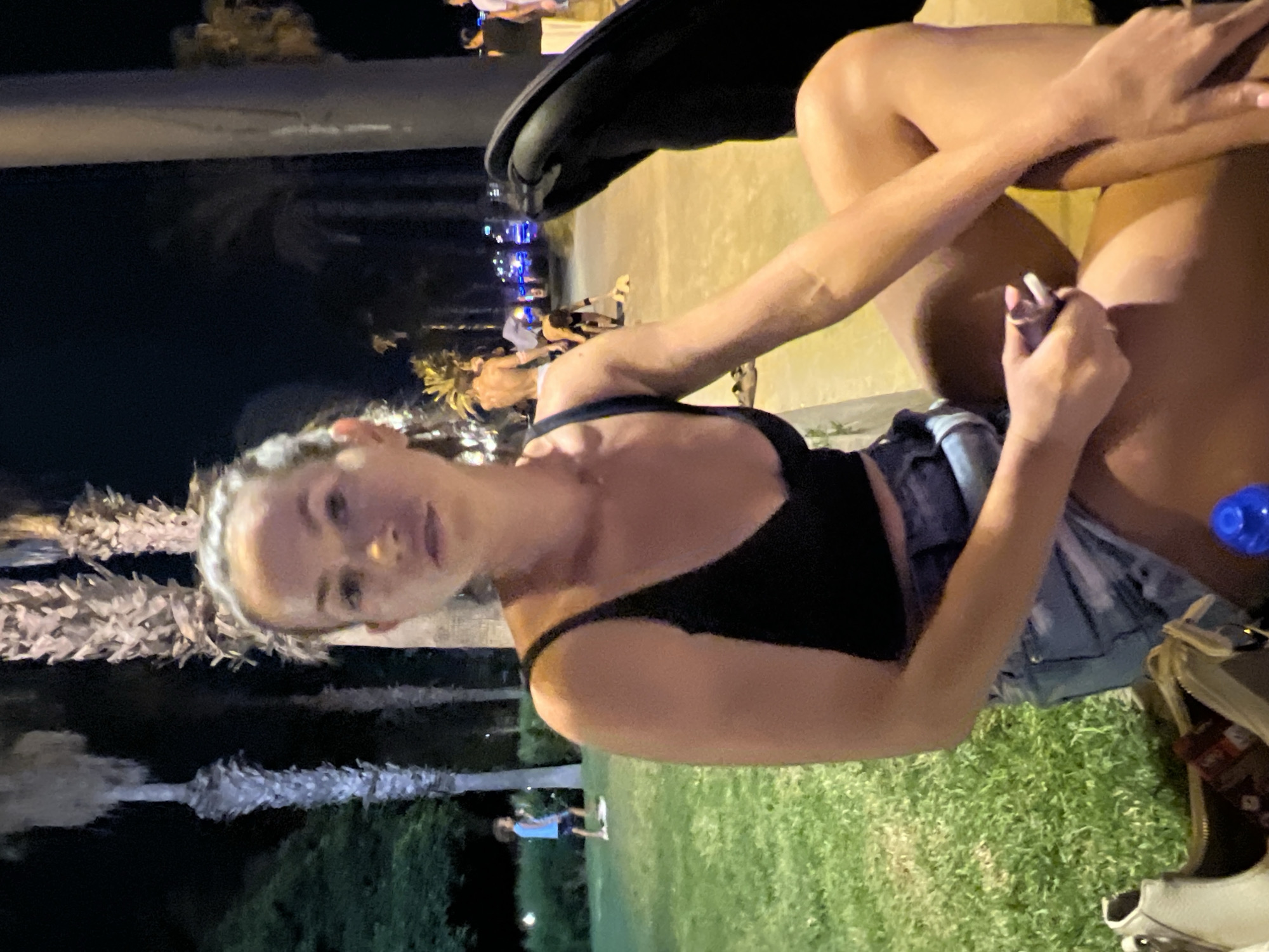 Evening on the Salou waterfront, phone and vape in hand