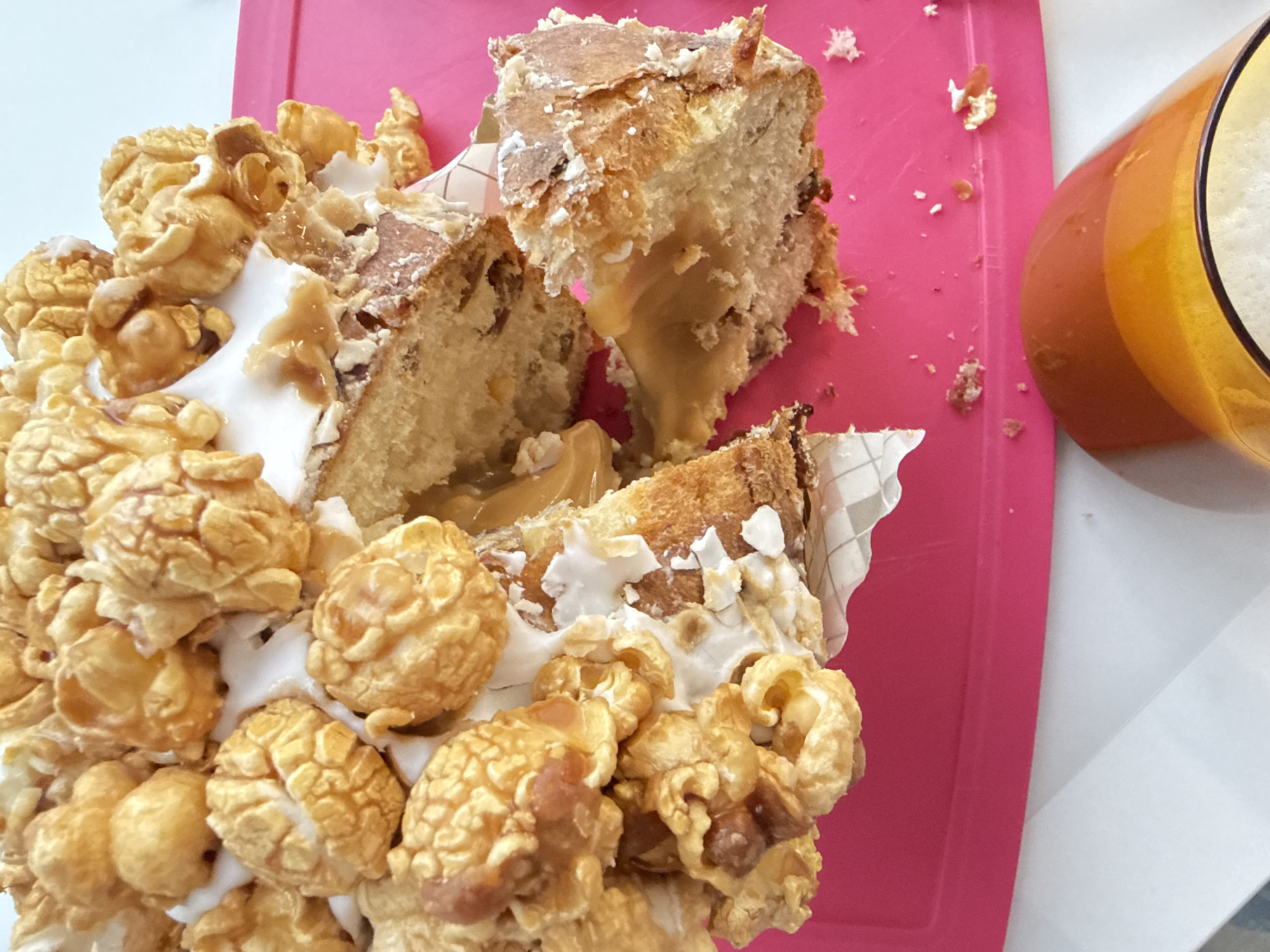 Decorated caramel cake partially eaten in Saint Petersburg morning