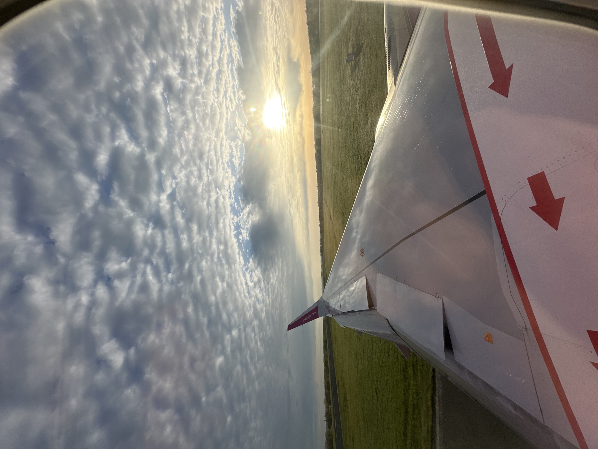 Passenger documents Wizz Air flight wing view over Dortmund