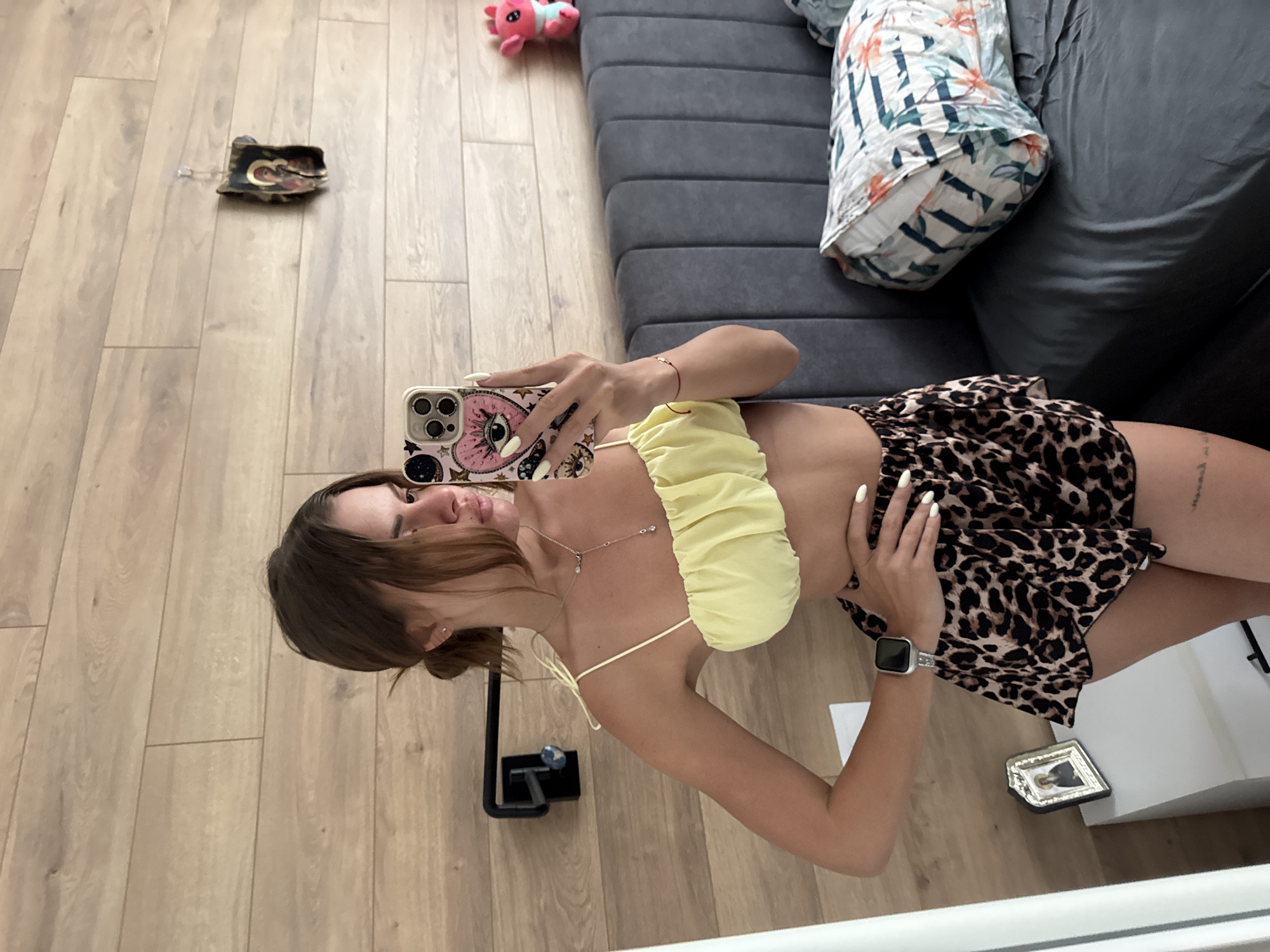 Woman Takes Multiple Mirror Selfies in Plovdiv Bedroom