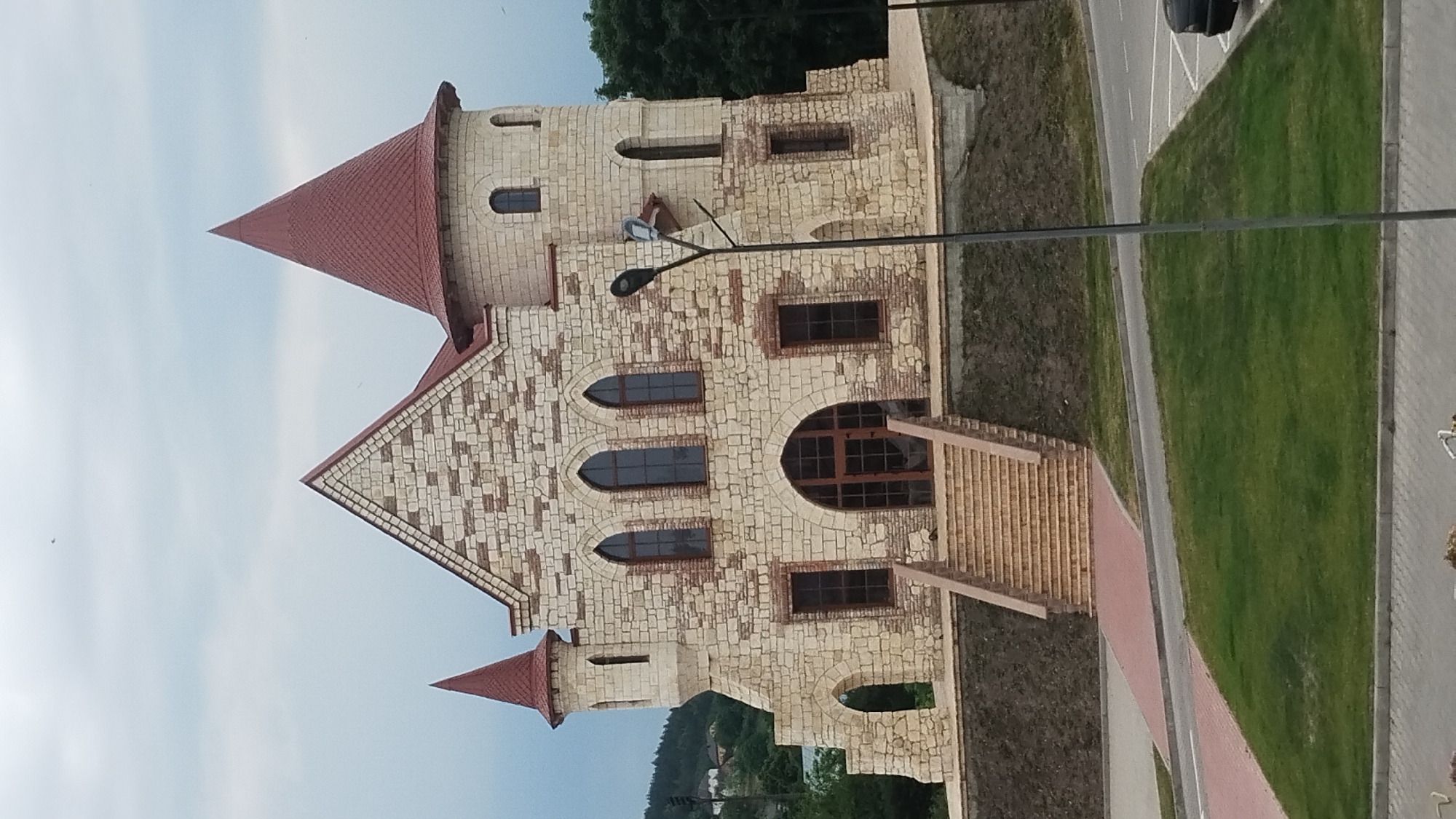 Fairytale stone castle with red conical roof in Berezhany