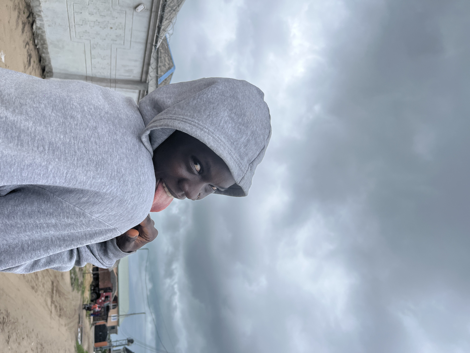 Young people gather on dirt roads in Badagry, Nigeria
