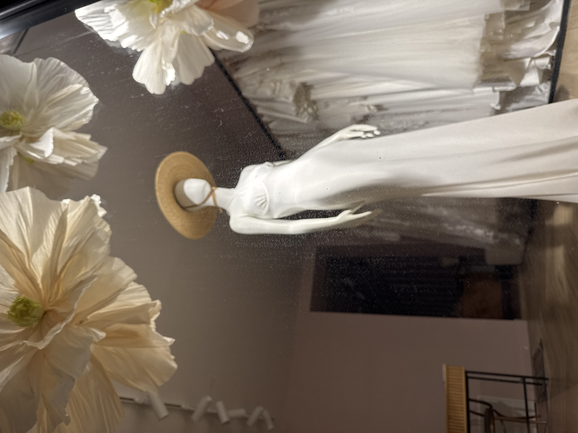 Boutique window displays in Poznan — dresses and terrariums