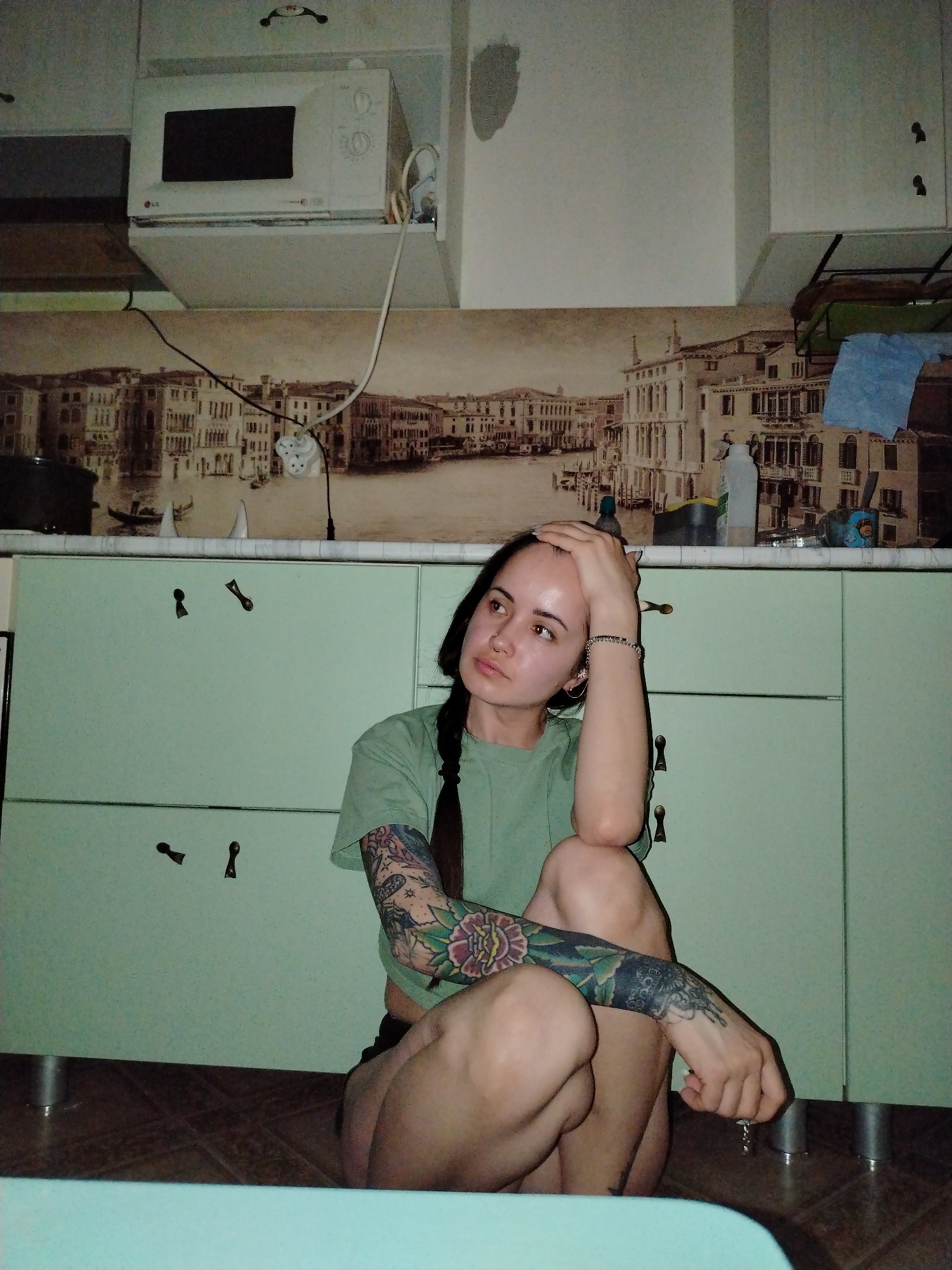 Indoor moments captured featuring decorated face and blanket-wrapped person