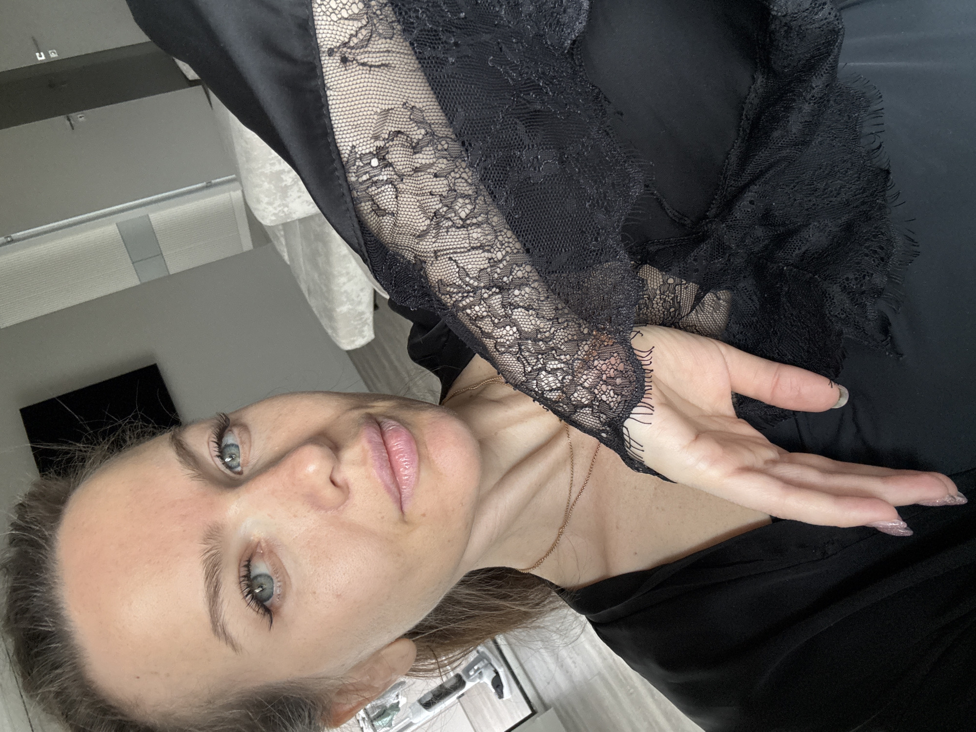 Woman captures quiet window moment in Dolgoprudny apartment