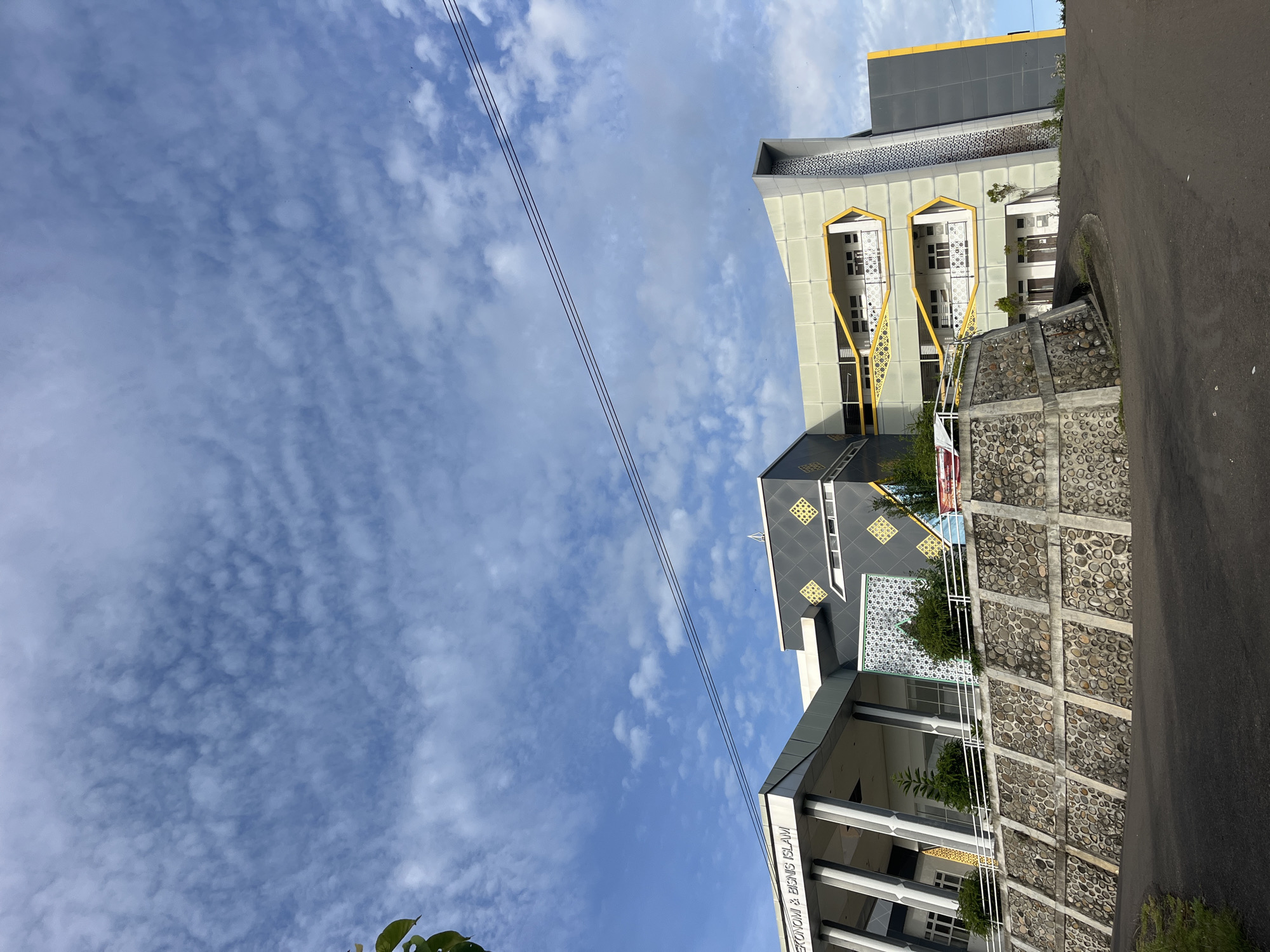 Witness documents architectural and botanical scenes during Lhokseumawe journey