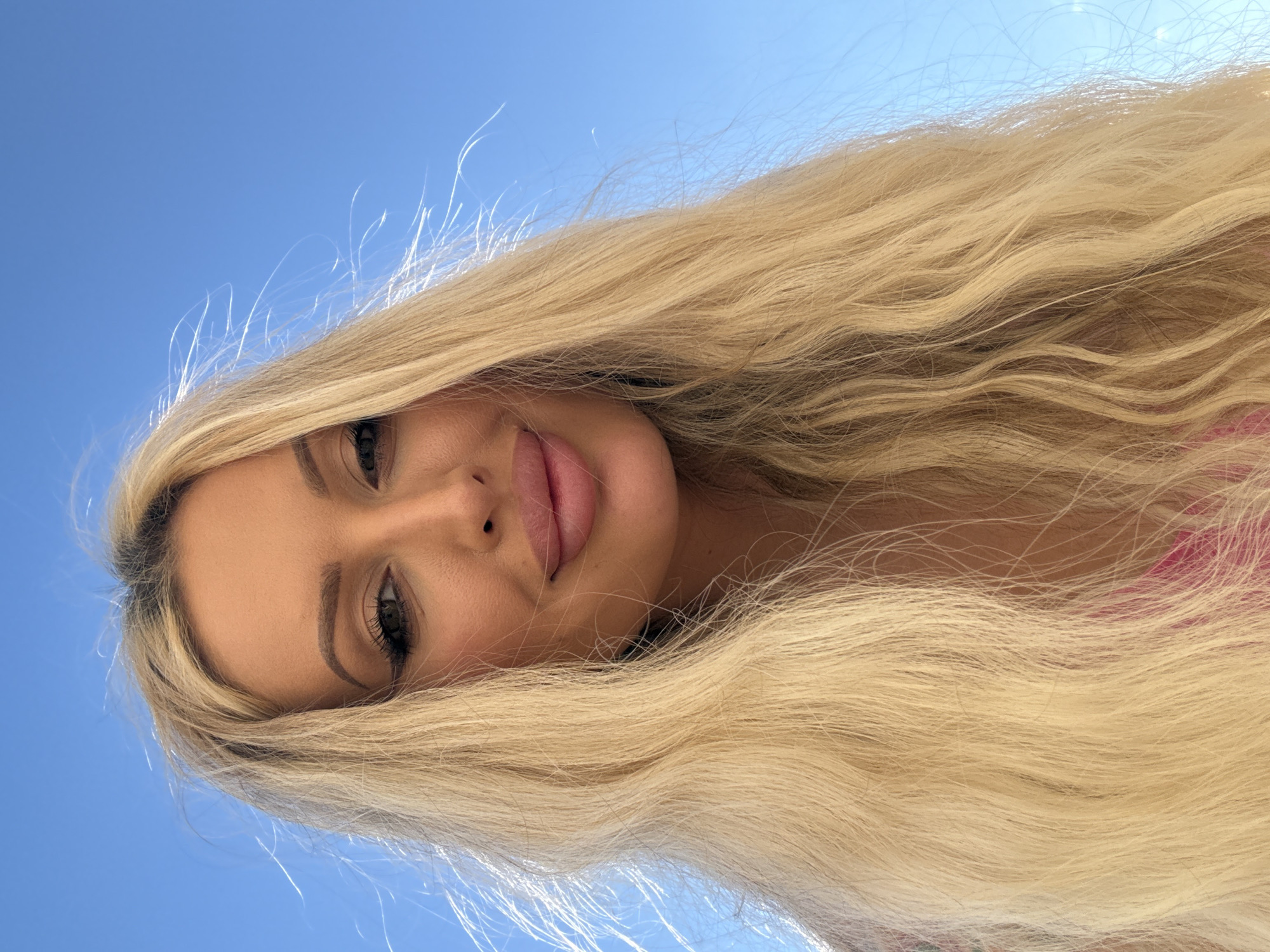 Sunny outdoor selfie series, blue sky and wind