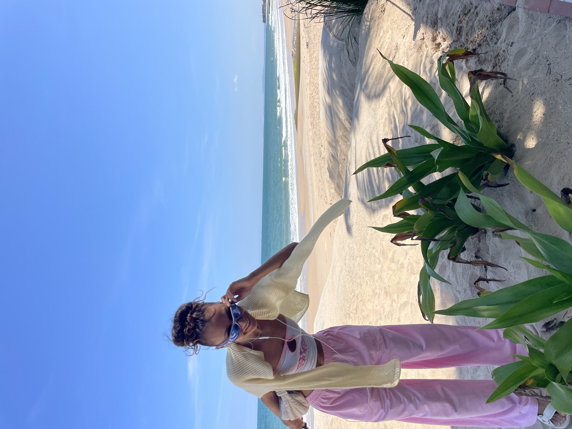 Woman poses on Vietnamese beach during early morning visit