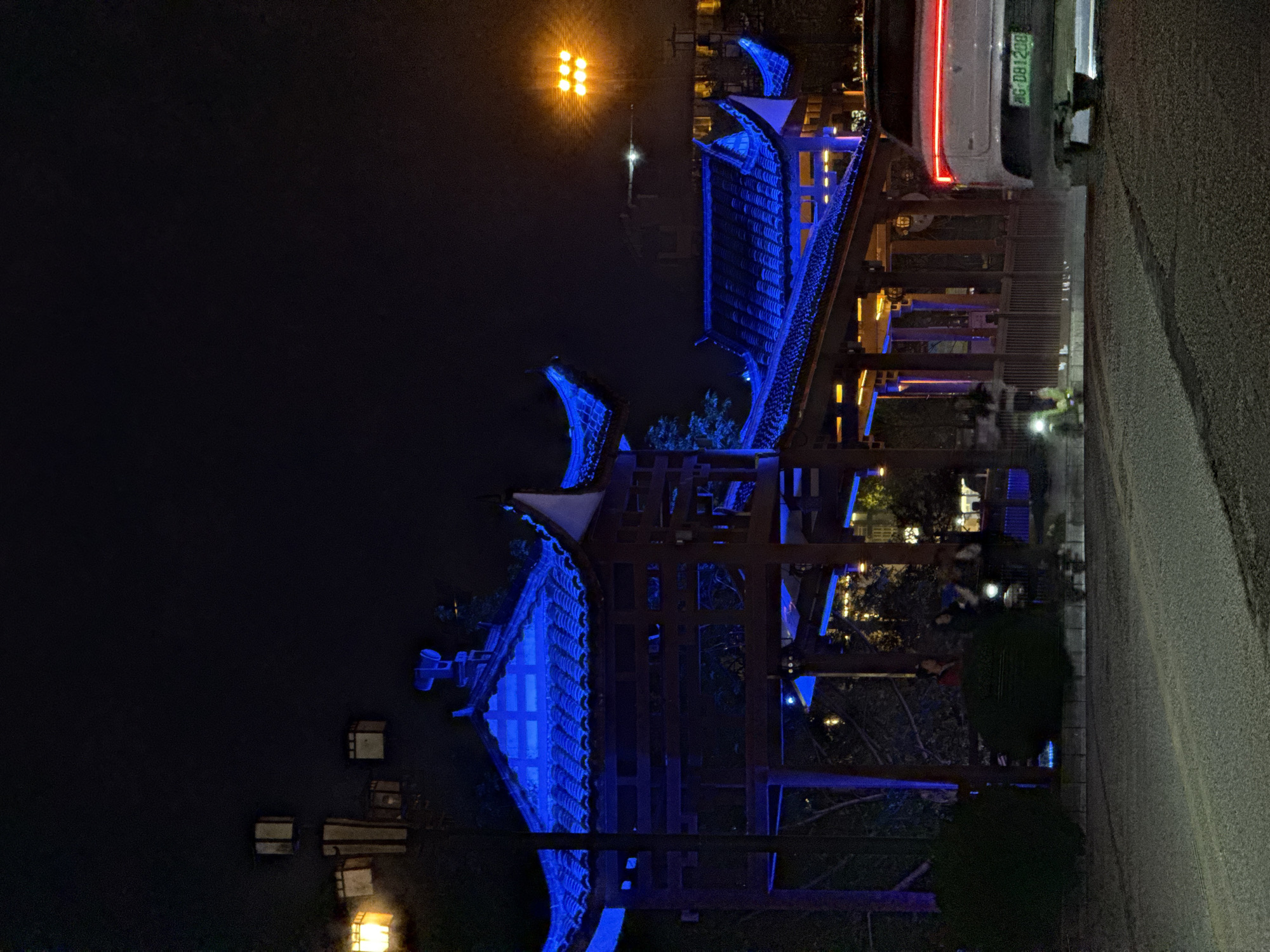 Traditional Chinese pavilions illuminated at night in Wulingyuan