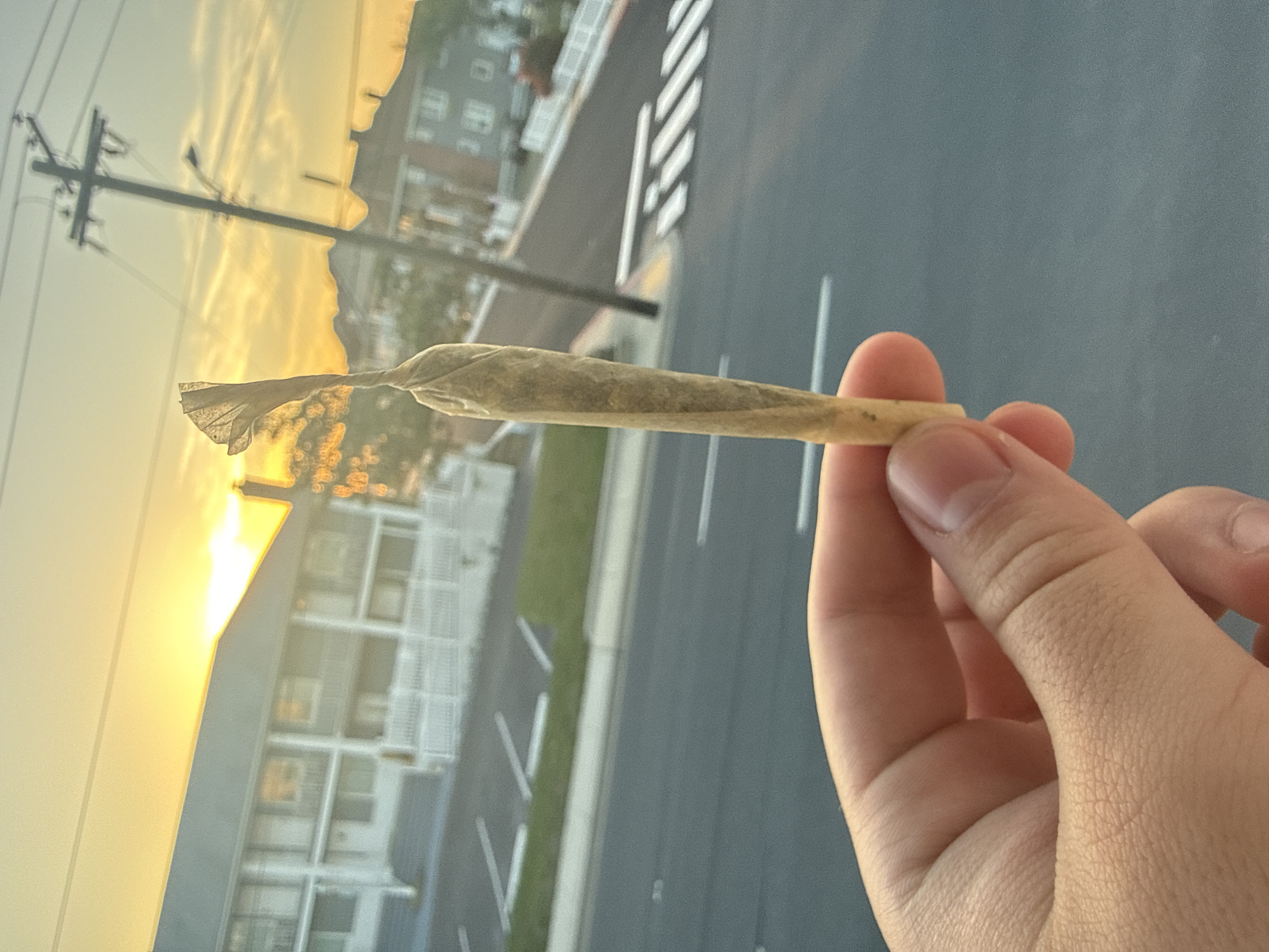 Individual observed handling cannabis products in Ocean City evening