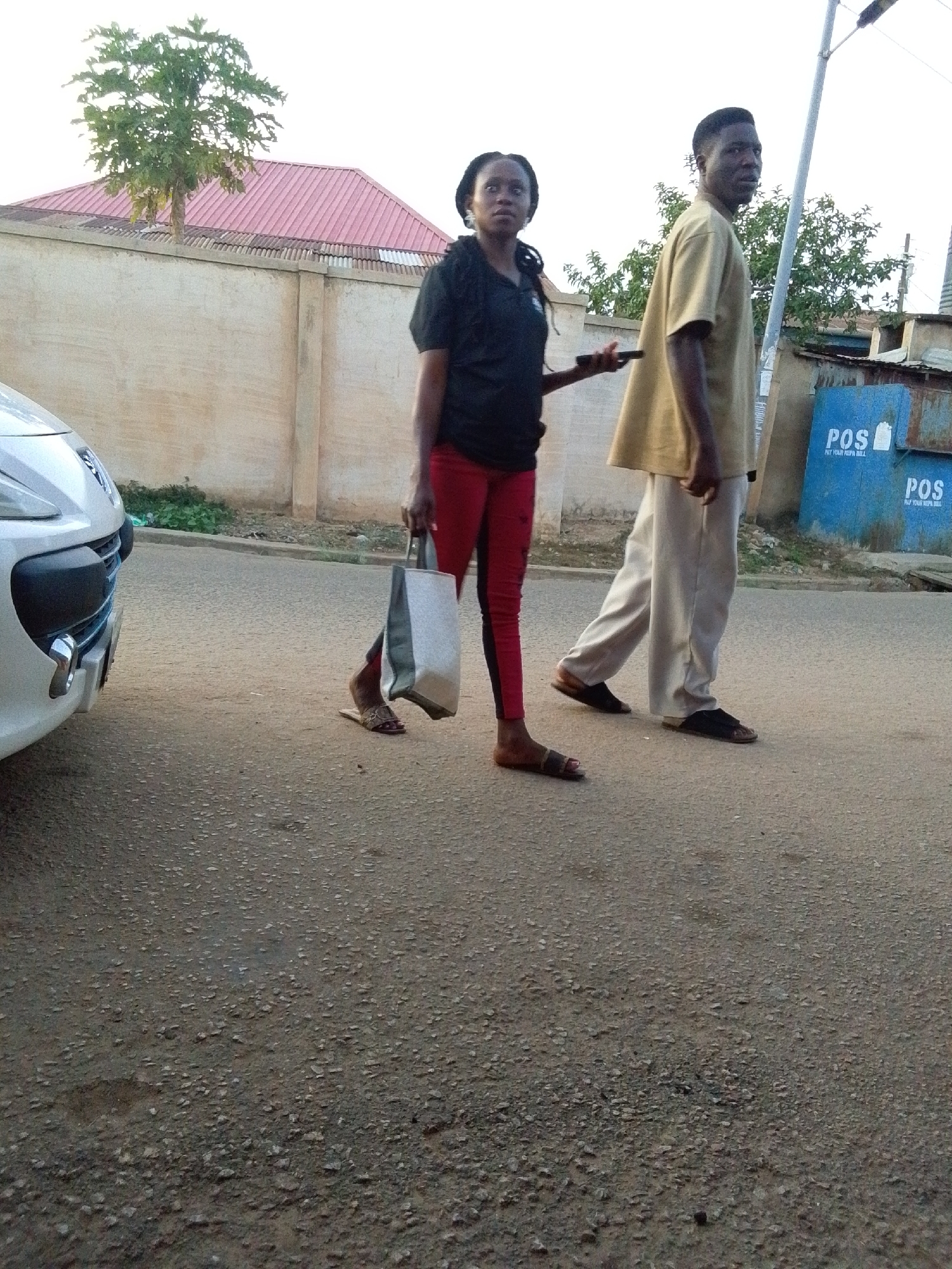 Pedestrians observed on asphalt road and rocky uphill path
