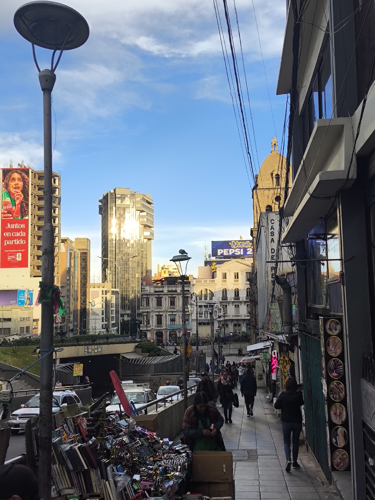 Evening street scenes captured across commercial areas of La Paz