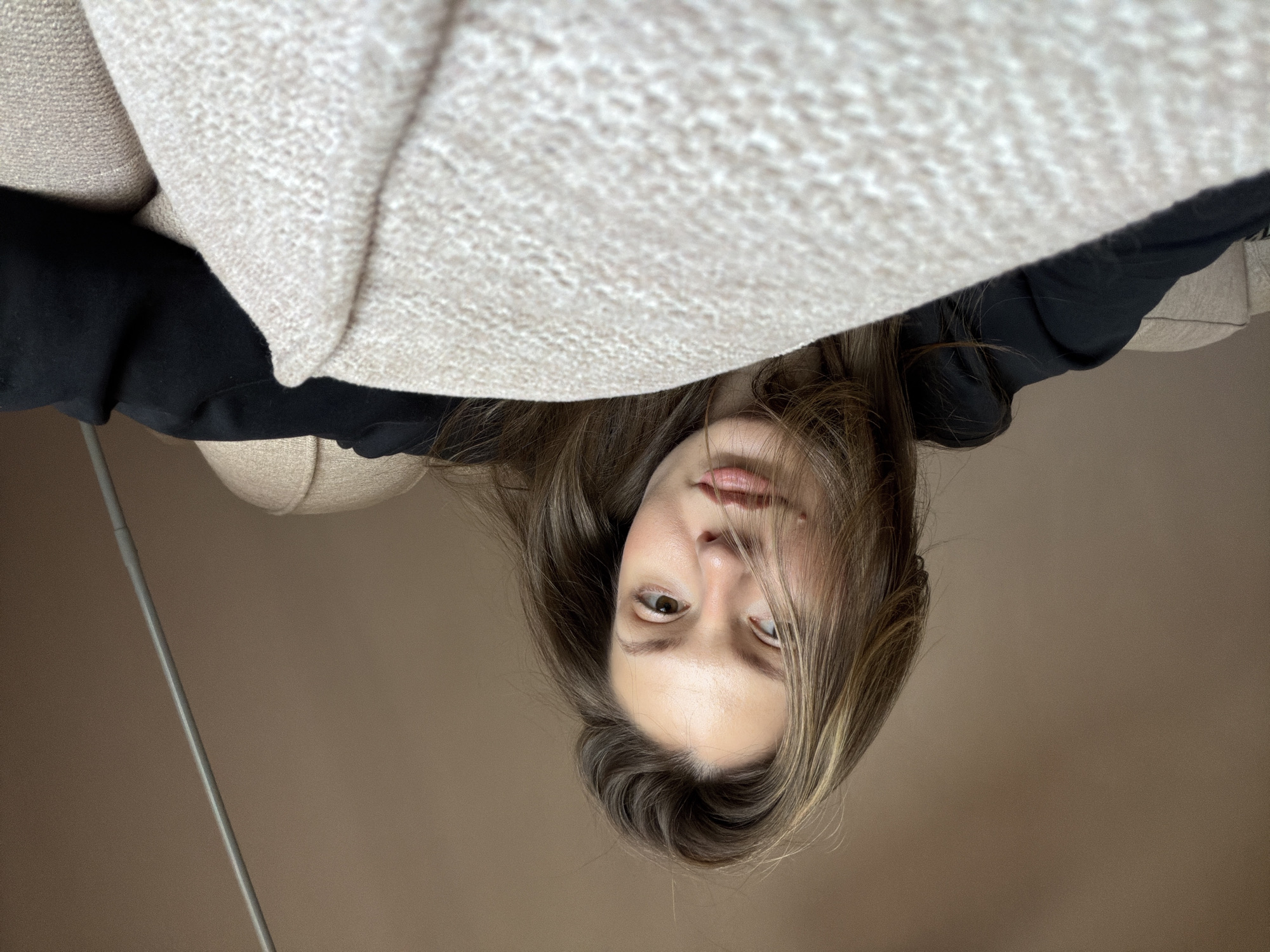 Inverted portrait photograph captured indoors in Riga, Latvia