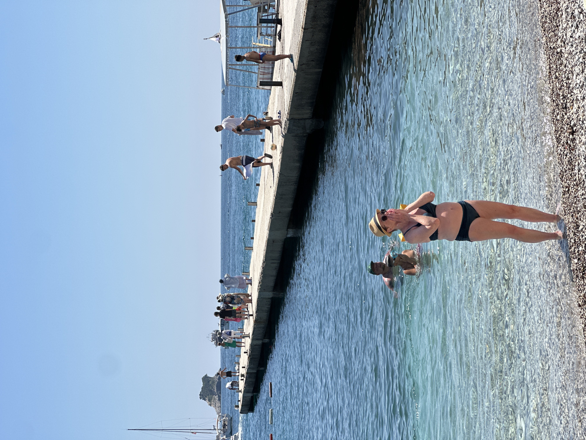 Sunny beach day captured at Budva pier, Montenegro