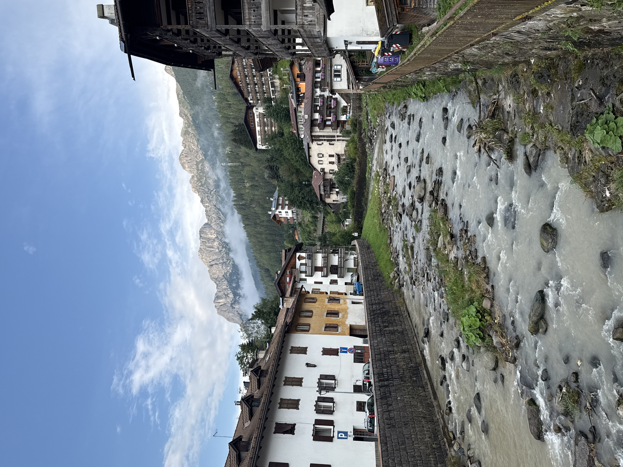 European-style mountain town with a river running through it