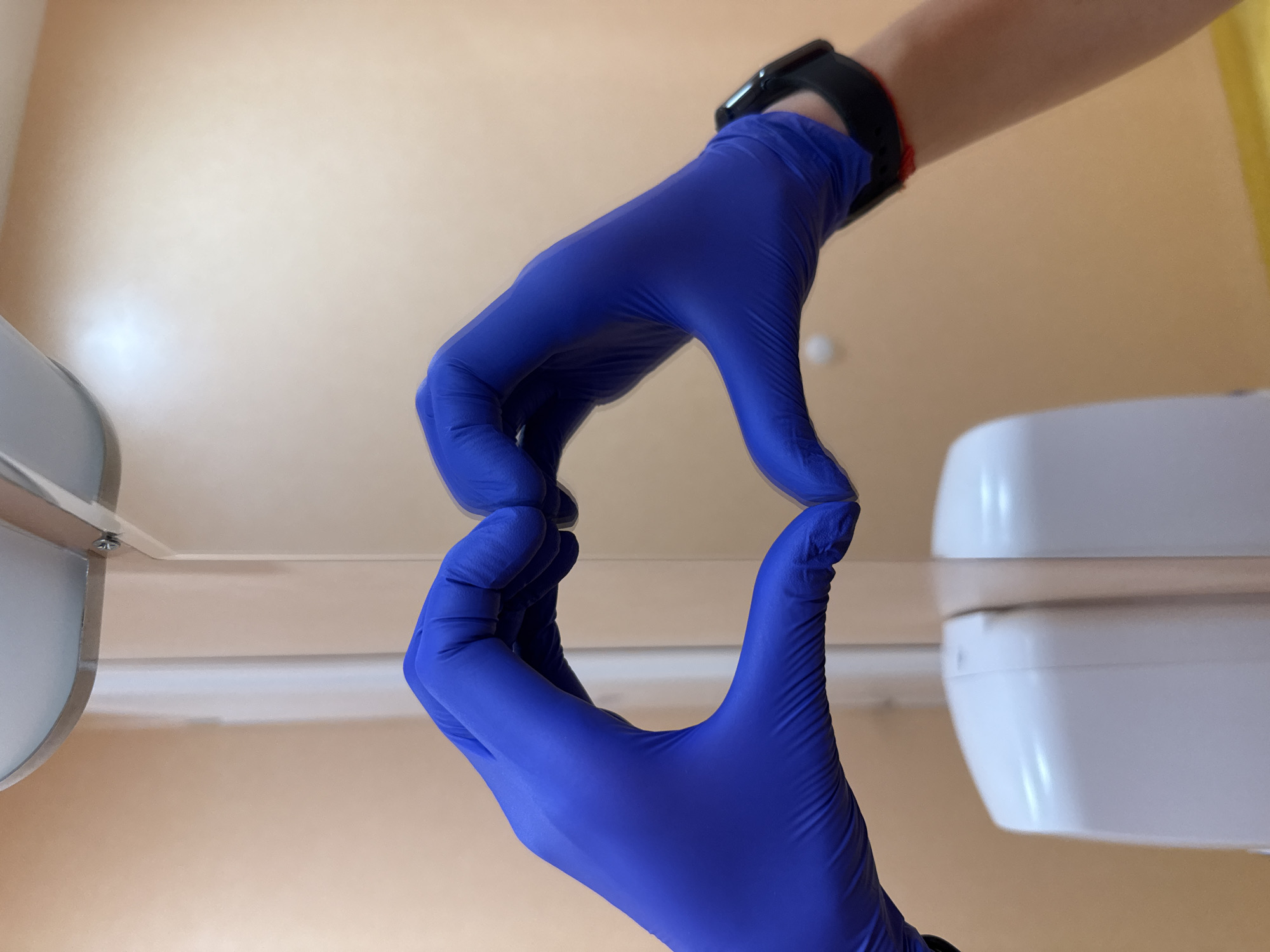 Person handles transparent material with protective gloves in Pleven