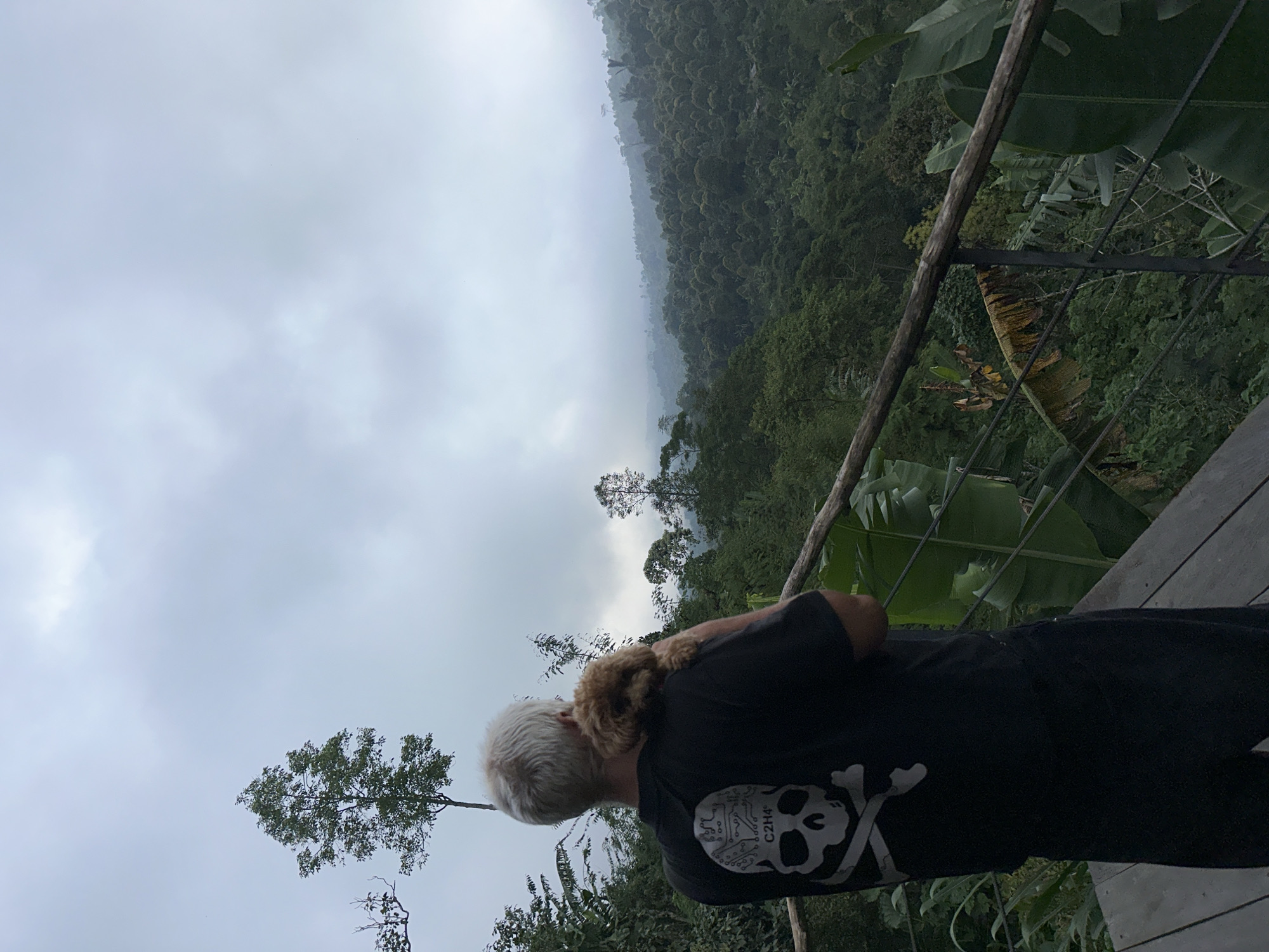 Person with dog photographed in Banjar Indonesia forest setting