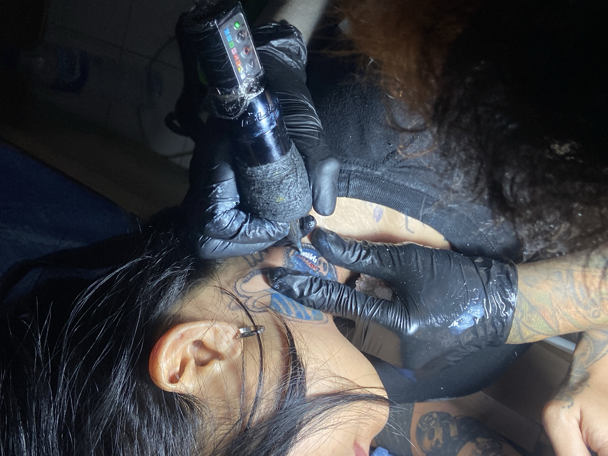 Tattoo session documented at Kuta studio, neck work completed
