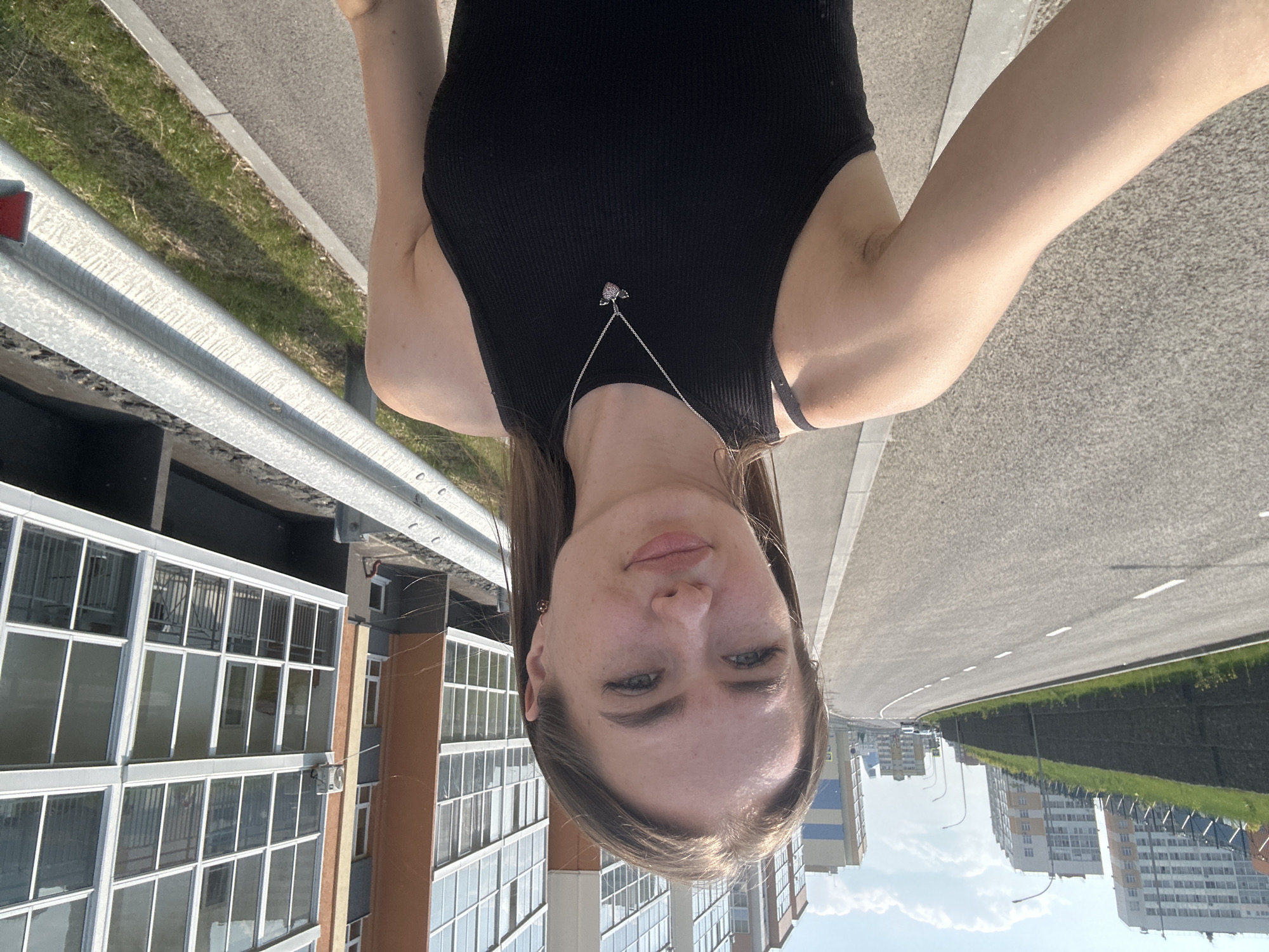 Selfies outside a colorful high-rise residential complex