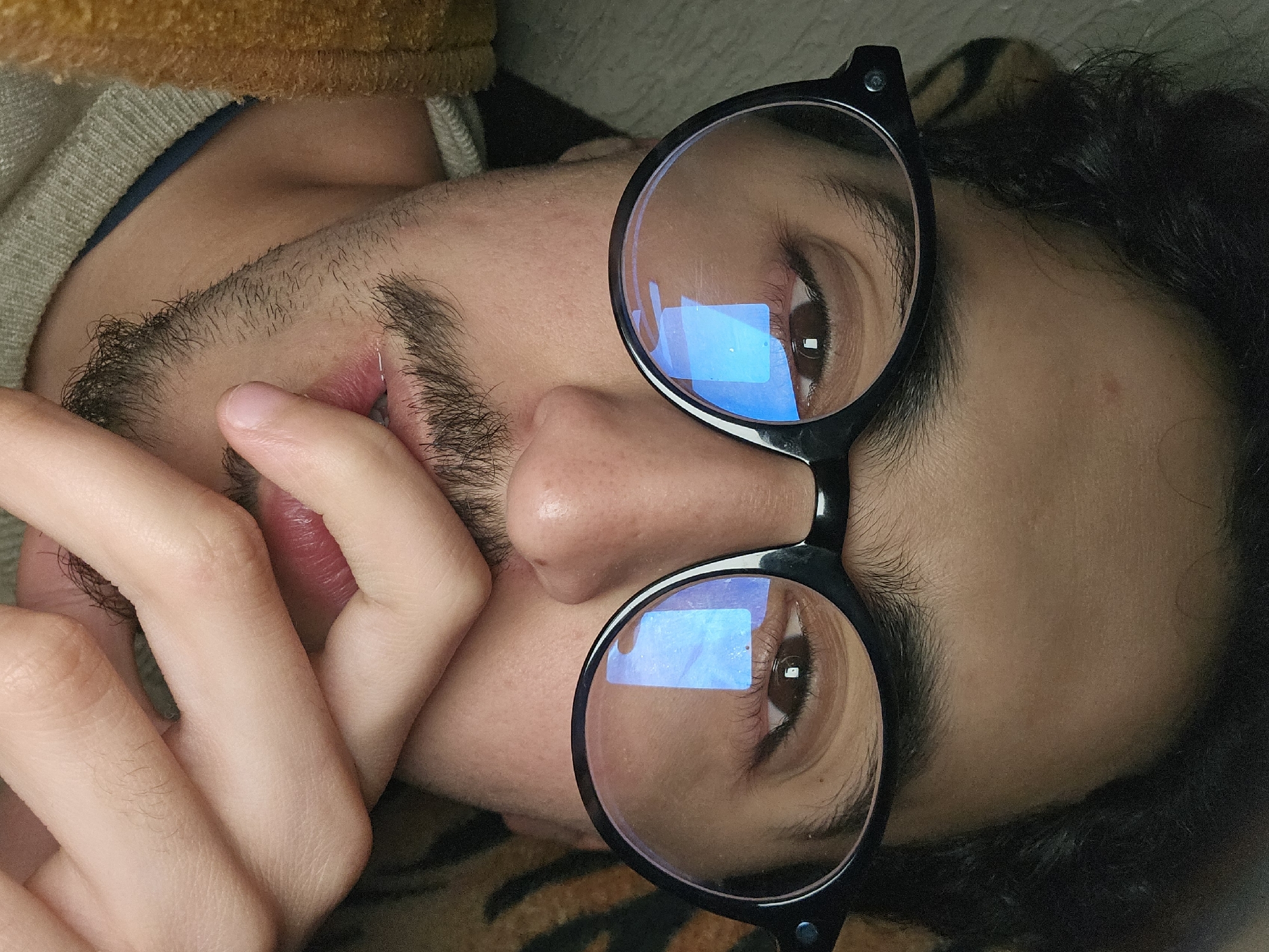 Person in glasses photographed in close-up in Fez