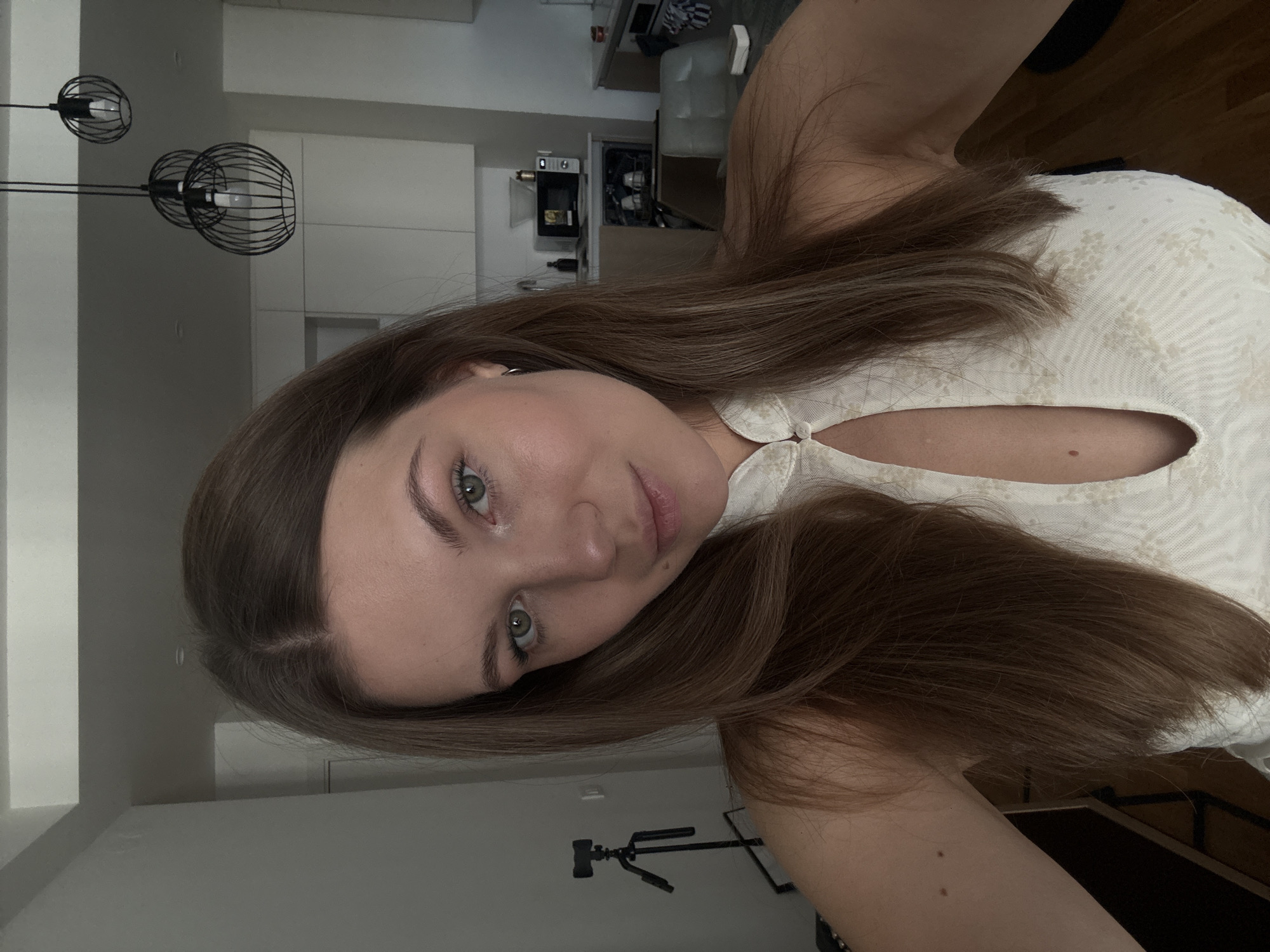 Selfie in a modern Belgrade apartment, summer 2026.