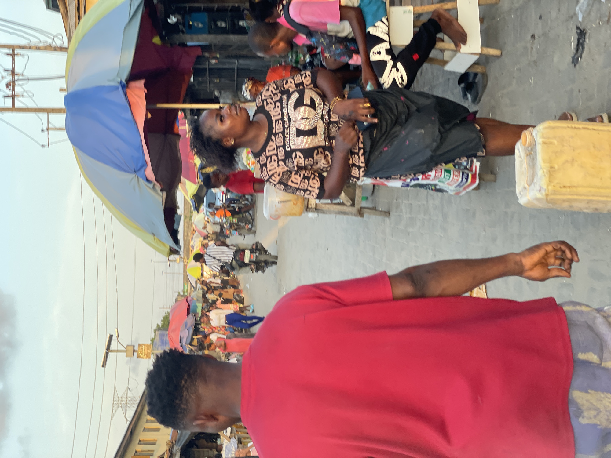 Daily street commerce unfolds across Lagos neighborhoods during evening hours