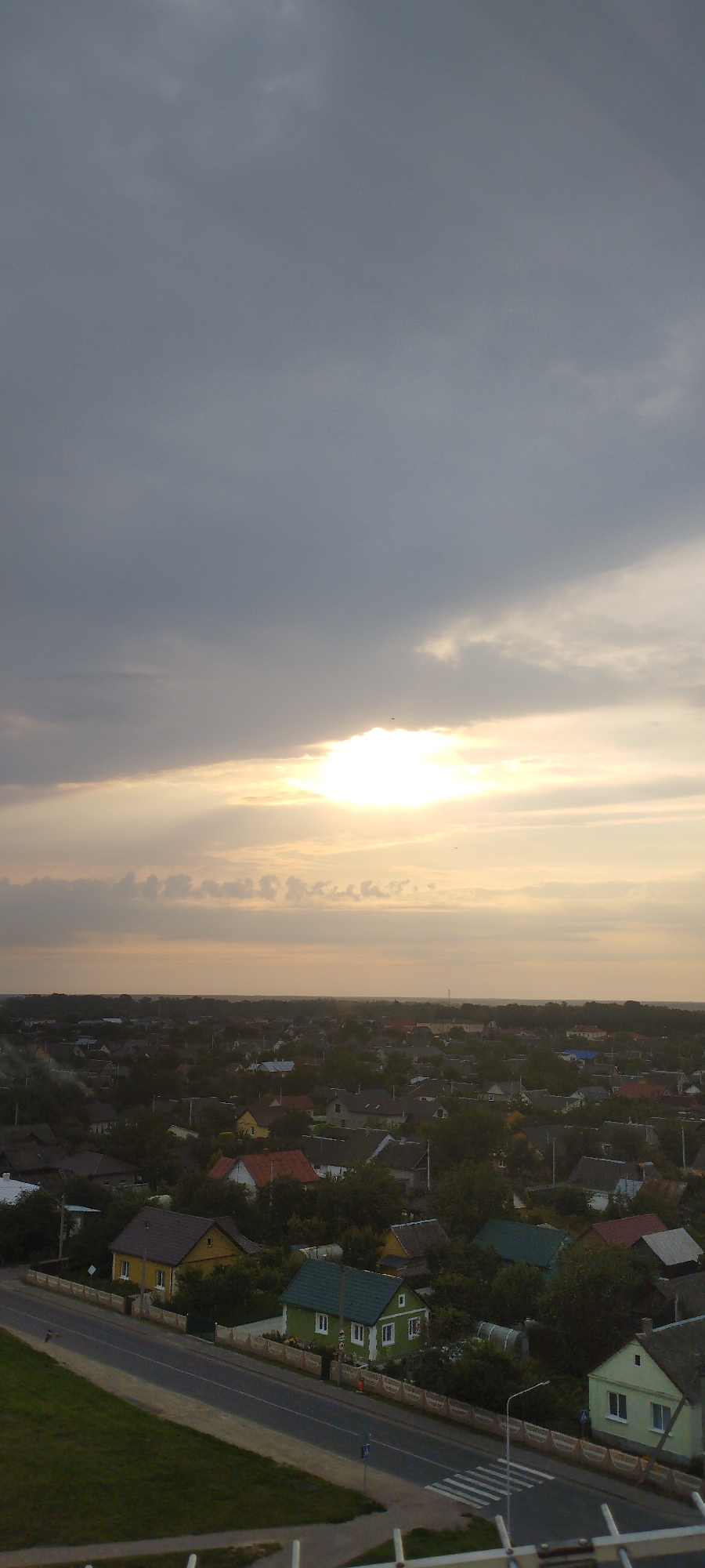 Suburban skyline caught between overcast and golden light