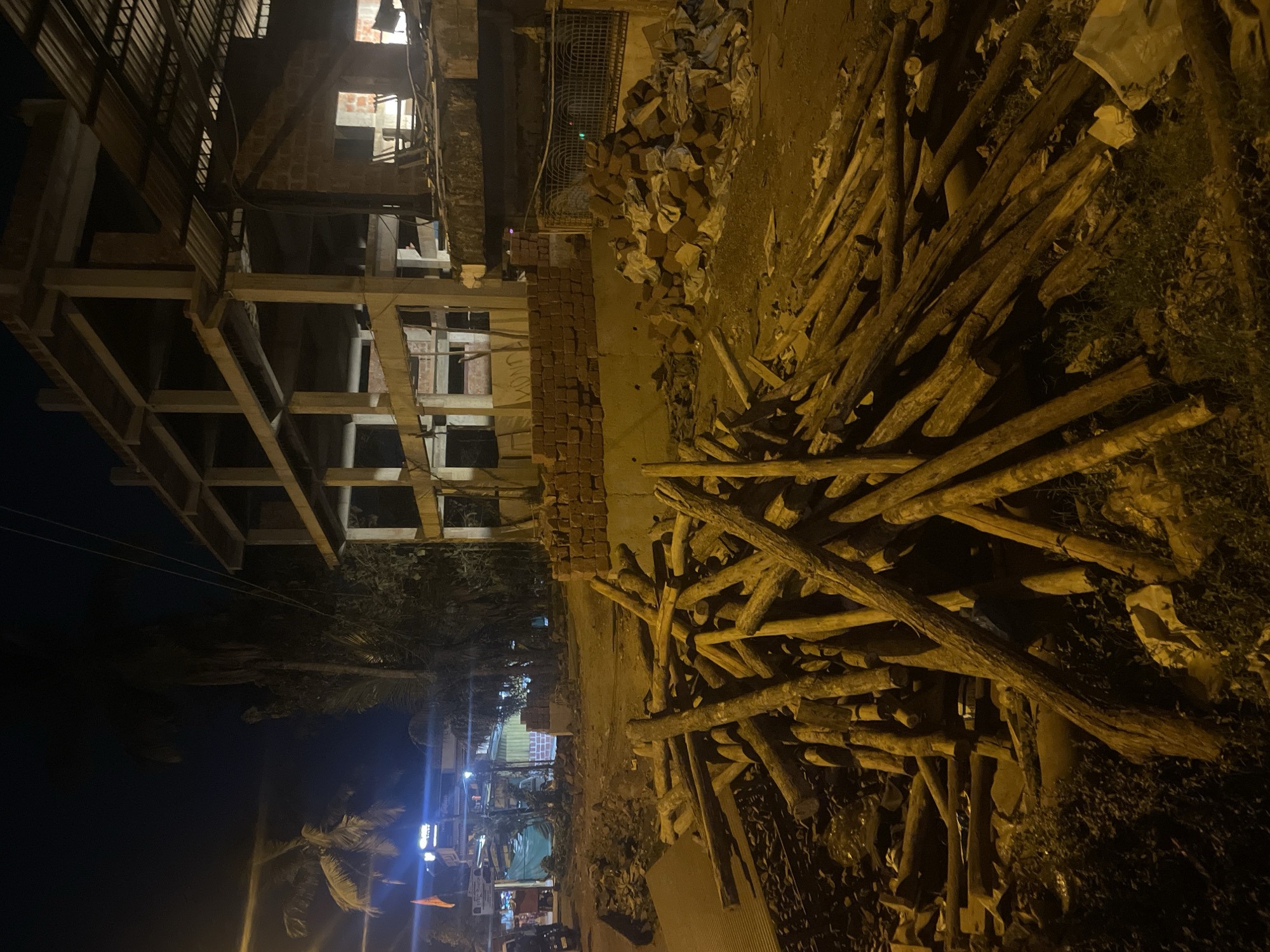 Construction site with building materials documented in Kudal