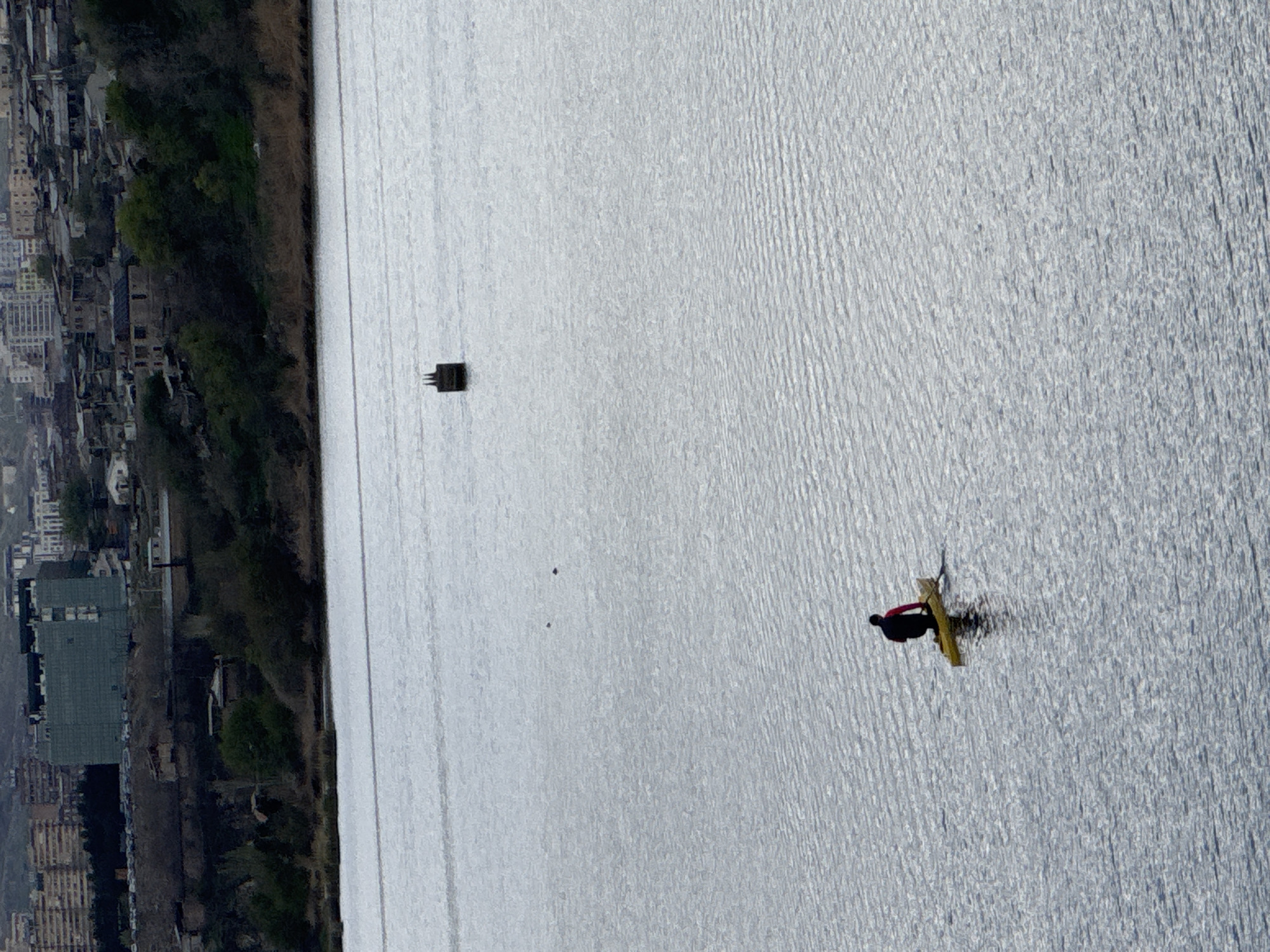 Kayaker spotted on Yerevan water body amid city skyline