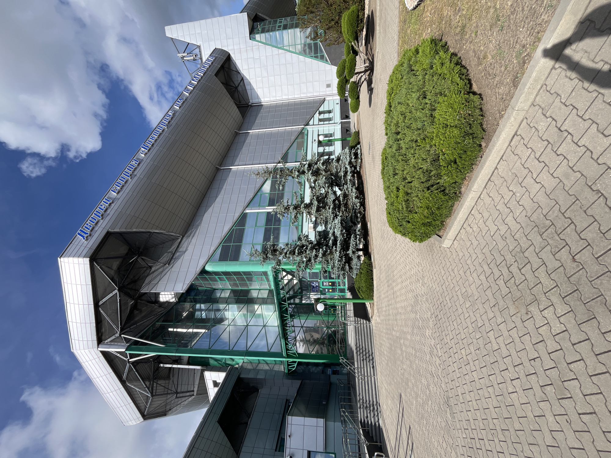 Modern sports arena complex exterior documented by witnesses